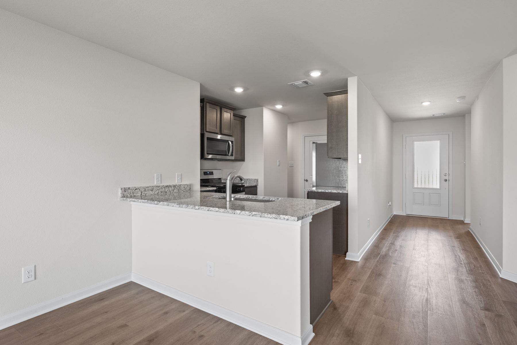 The kitchen has a wonderful breakfast bar.