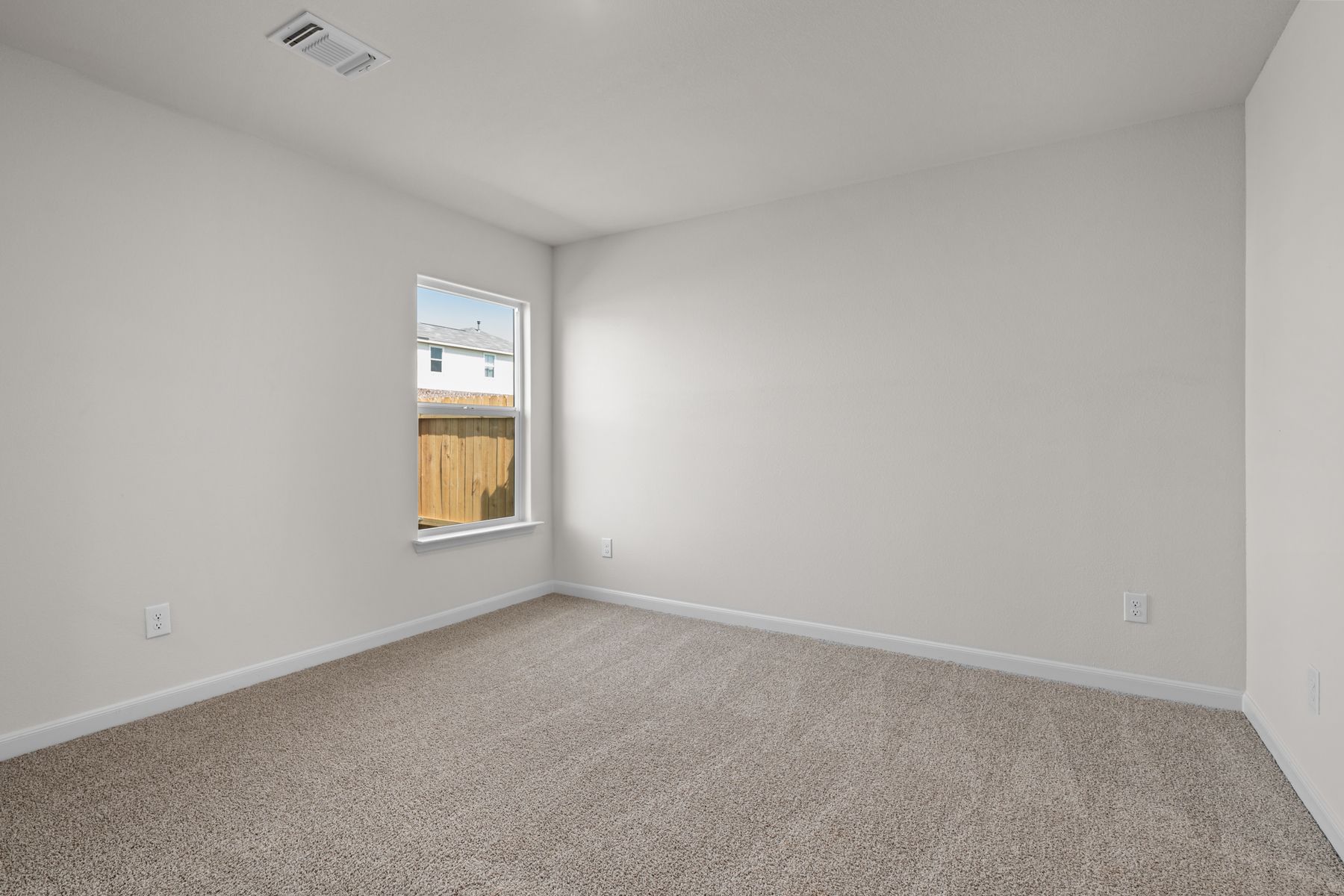 The master bedroom has a large window that lets in great, natural light.