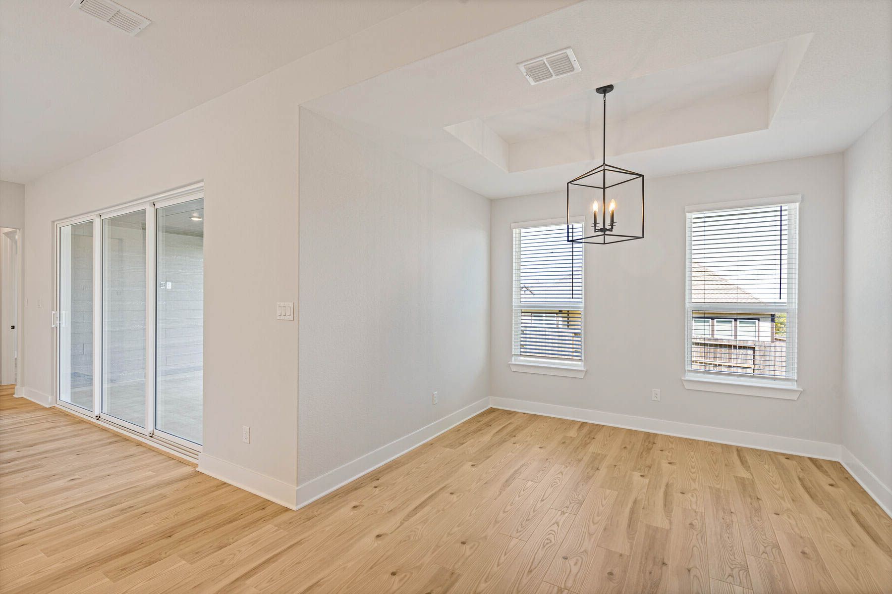 The dining room has two large windows that let in great, natural light.