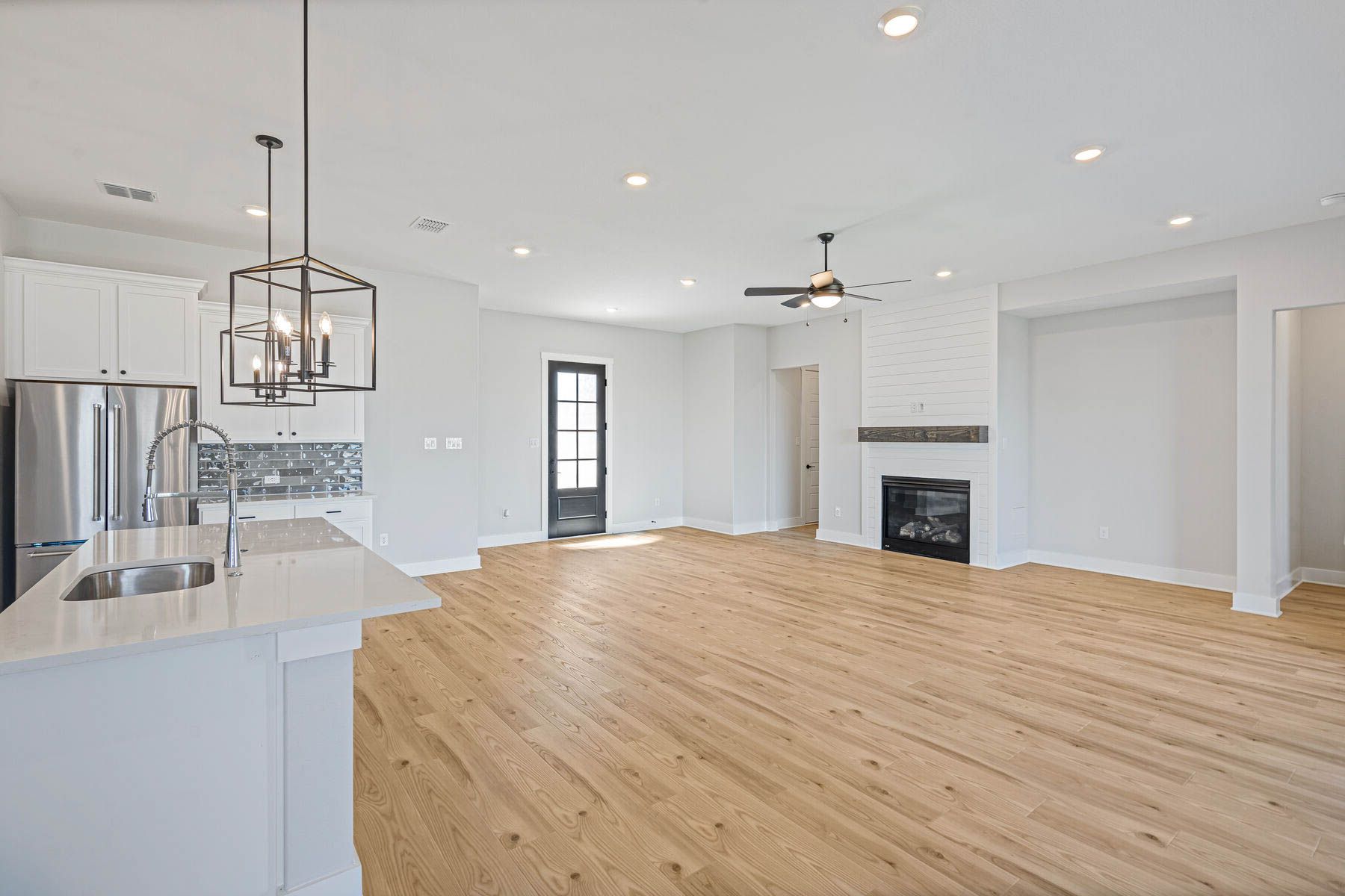 The living room has an electric fireplace.