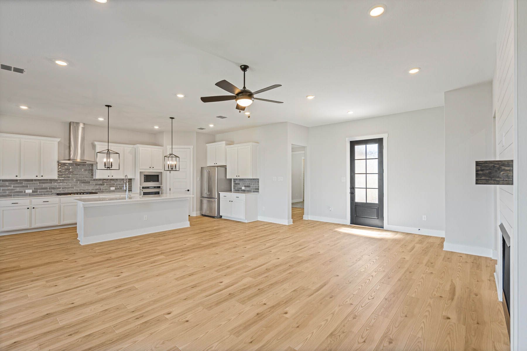 The spacious living room has plenty of space for large furniture.