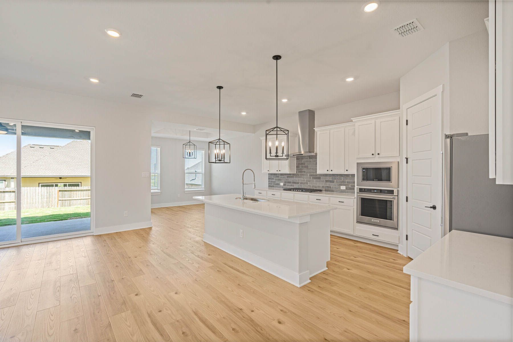 The Santos has an open floor plan that connects the kitchen, dining room and family room.