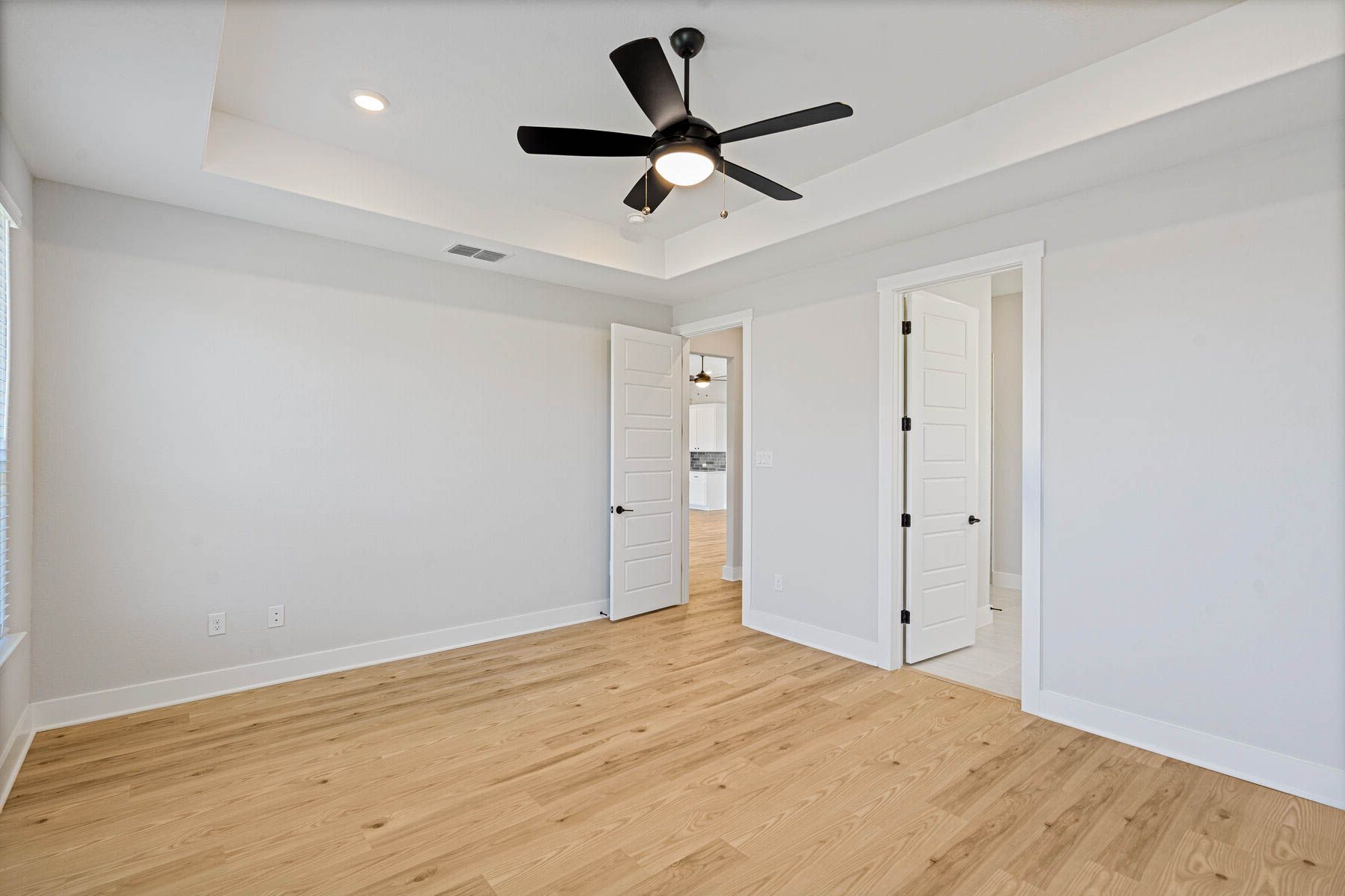 The master suite has a large bedroom, ensuite bathroom and a walk-in closet.