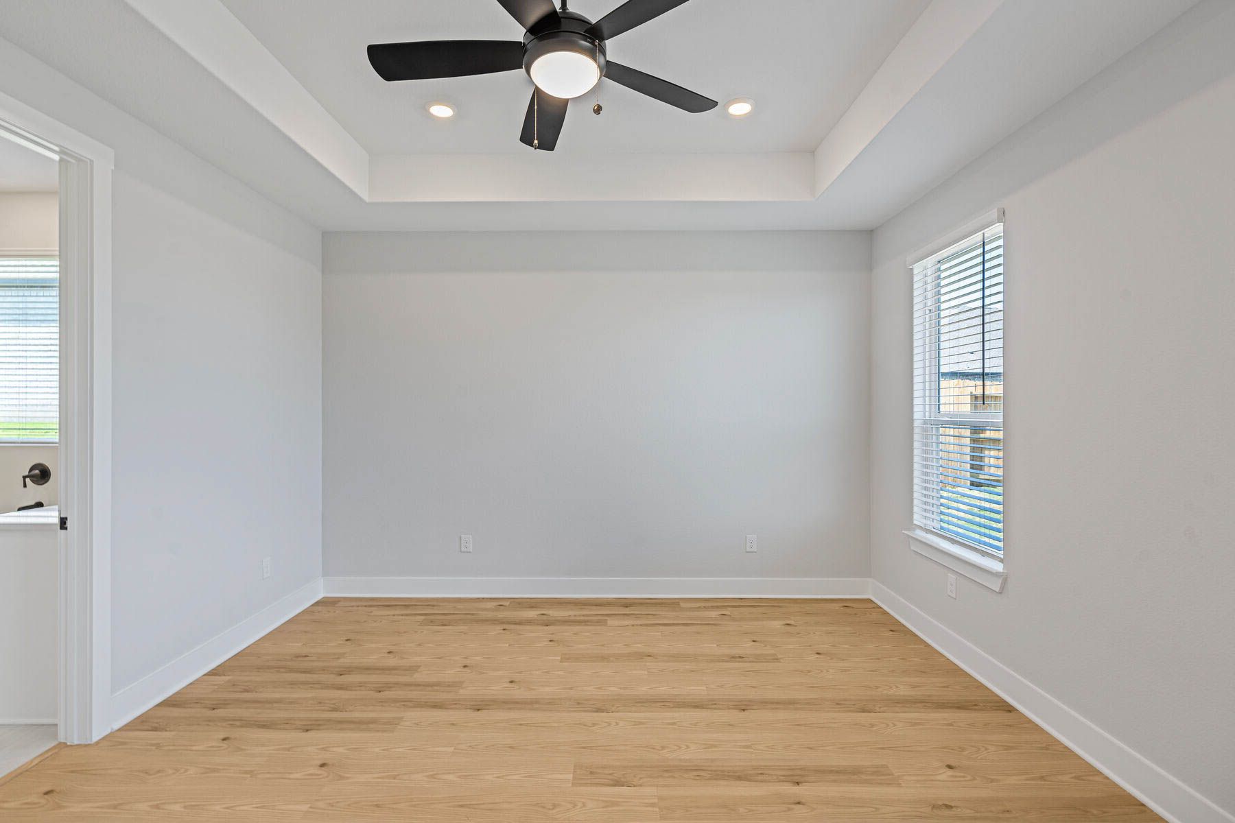 The master bedroom is spacious and has plenty of room for king-sized furniture.