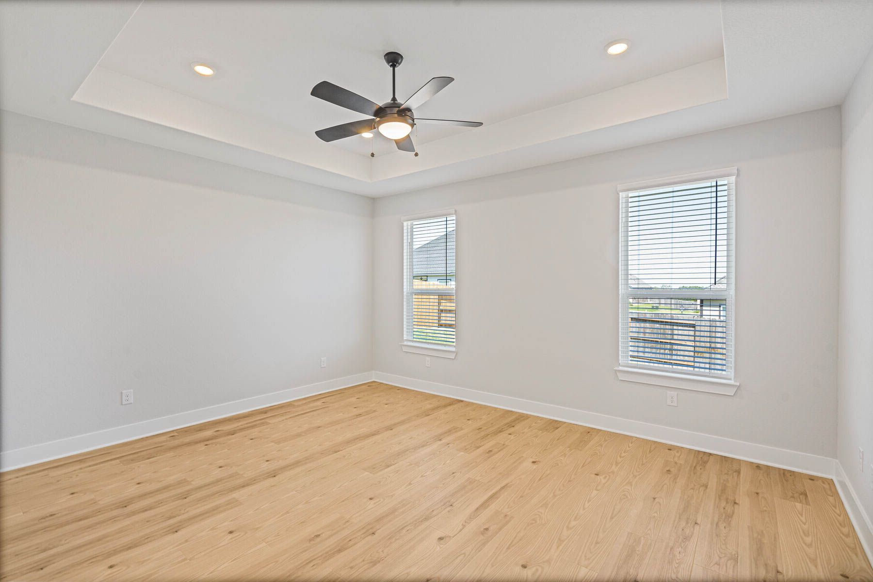 The master bedroom has two large windows that let in great, natural light.