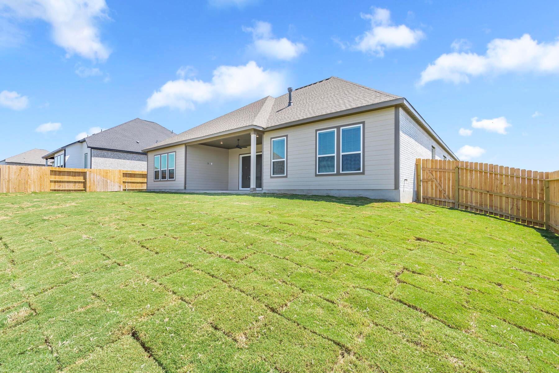 The large back yard provides plenty of space to run and play.