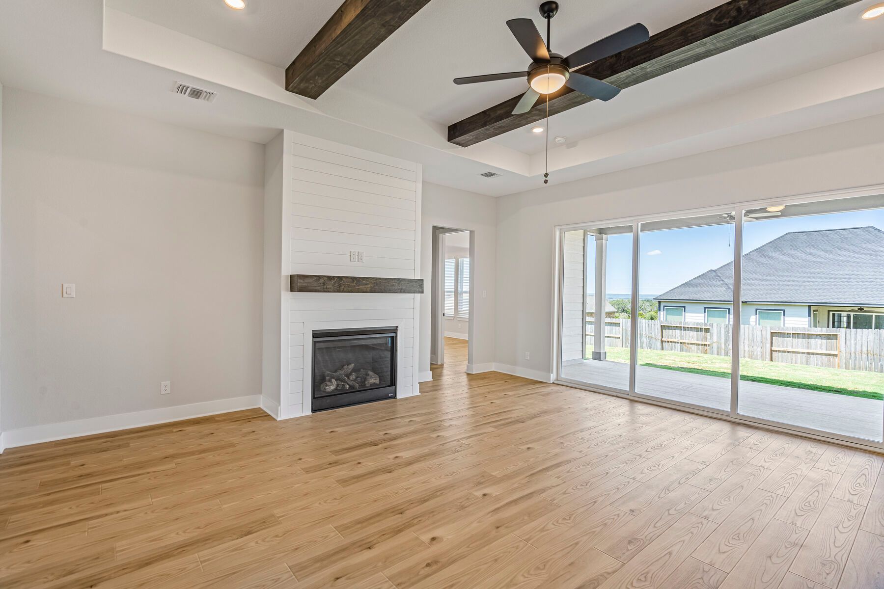 The family room has large windows that in great, natural light.