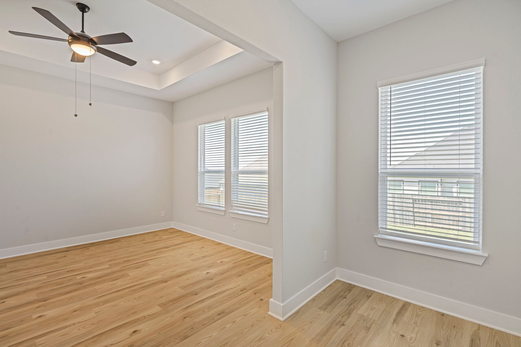 The master bedroom has three large windows that let in great, natural light.