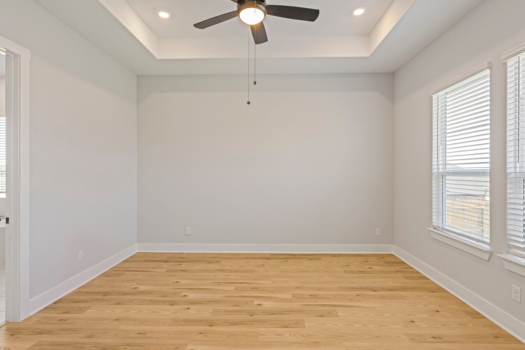The master bedroom is spacious and has plenty of space for king-sized furniture.