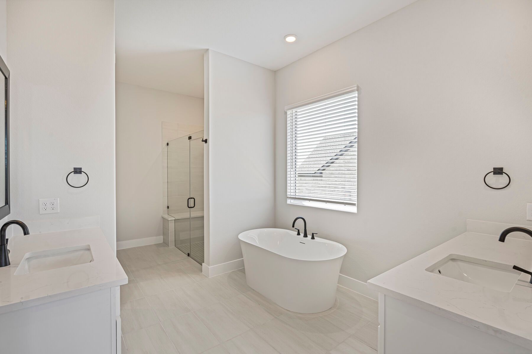The master bathroom has two large vanity spaces.