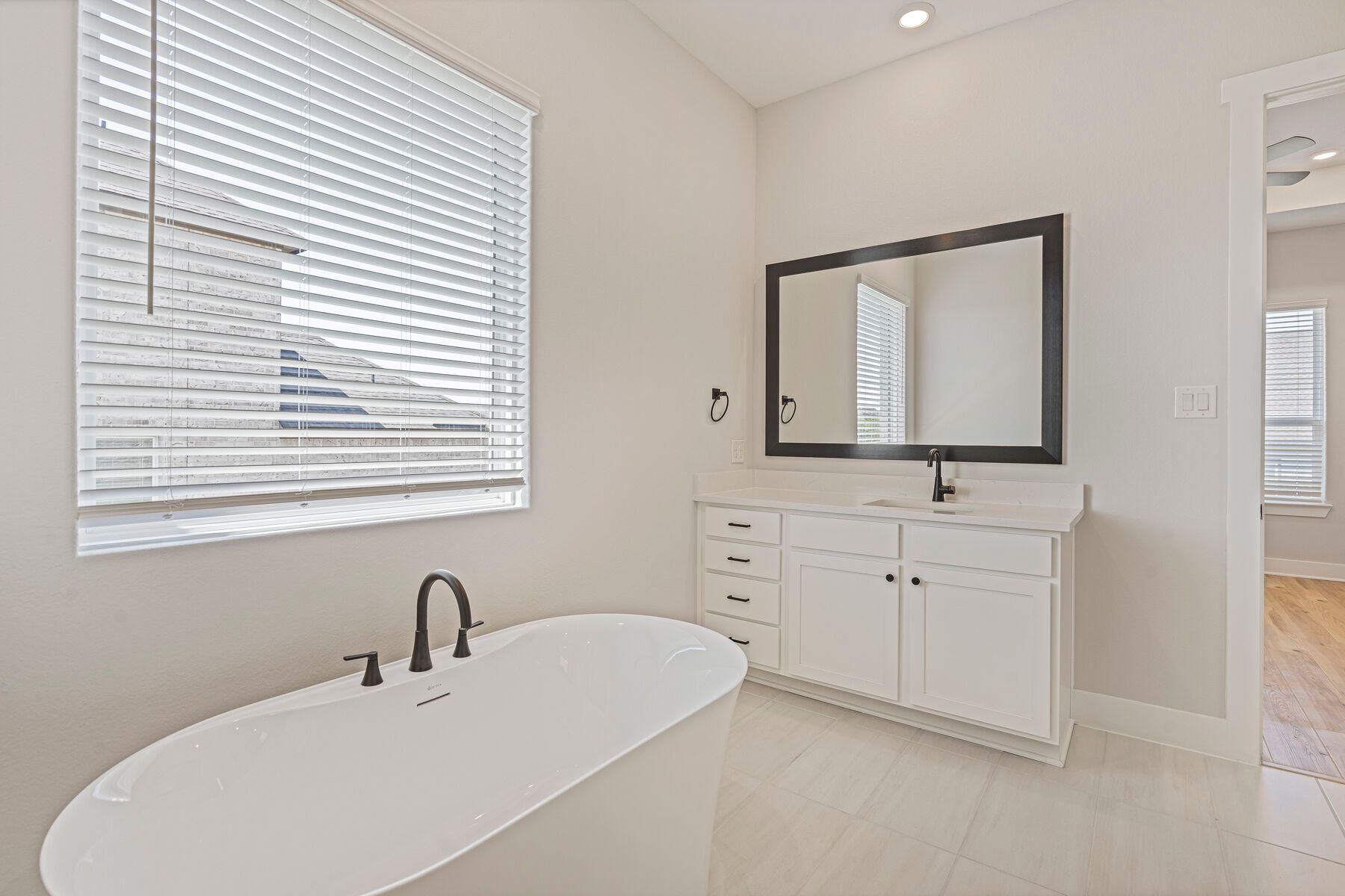 The master bathroom has a stand-alone tub.