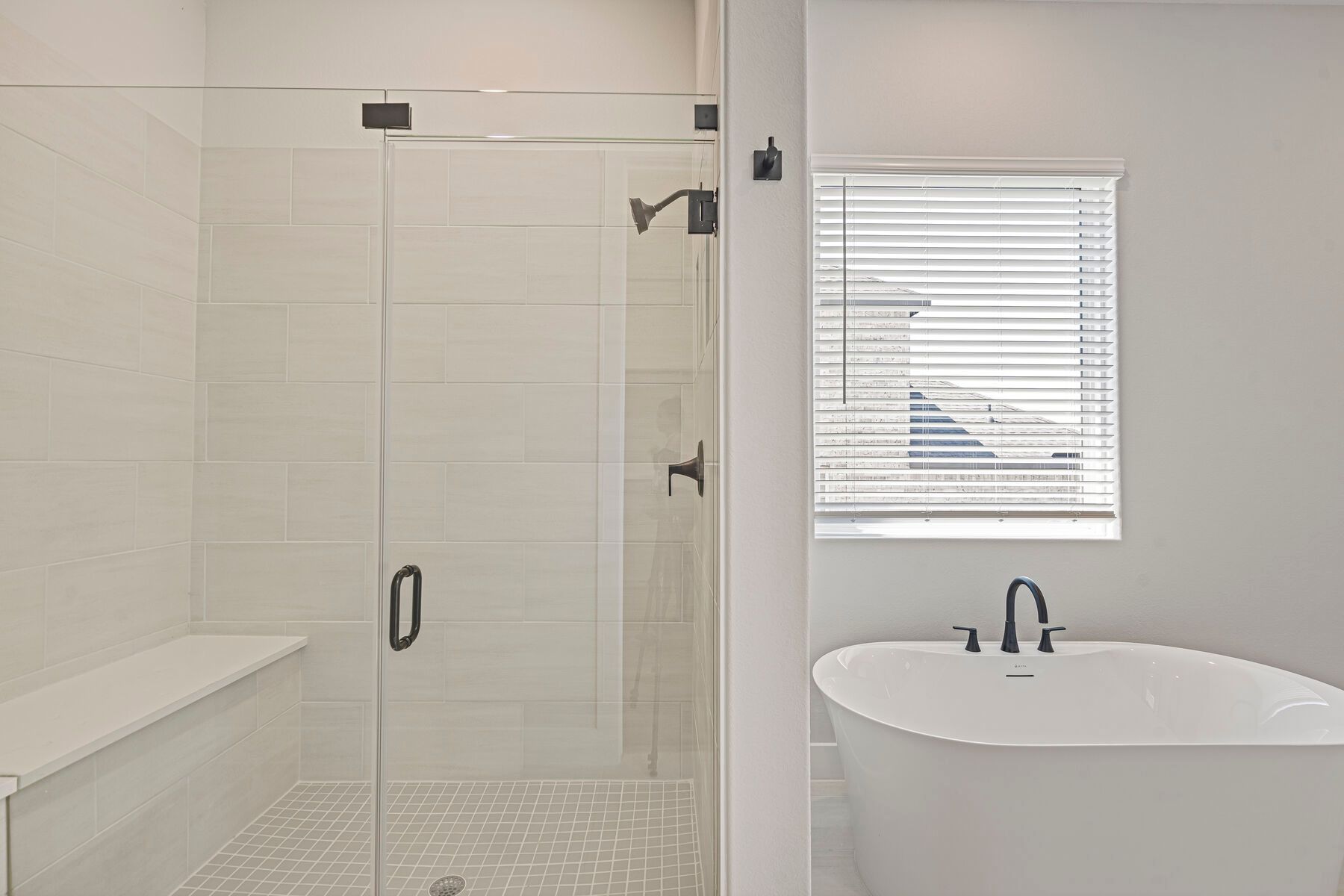 The master bathroom has a glass, walk-in shower.
