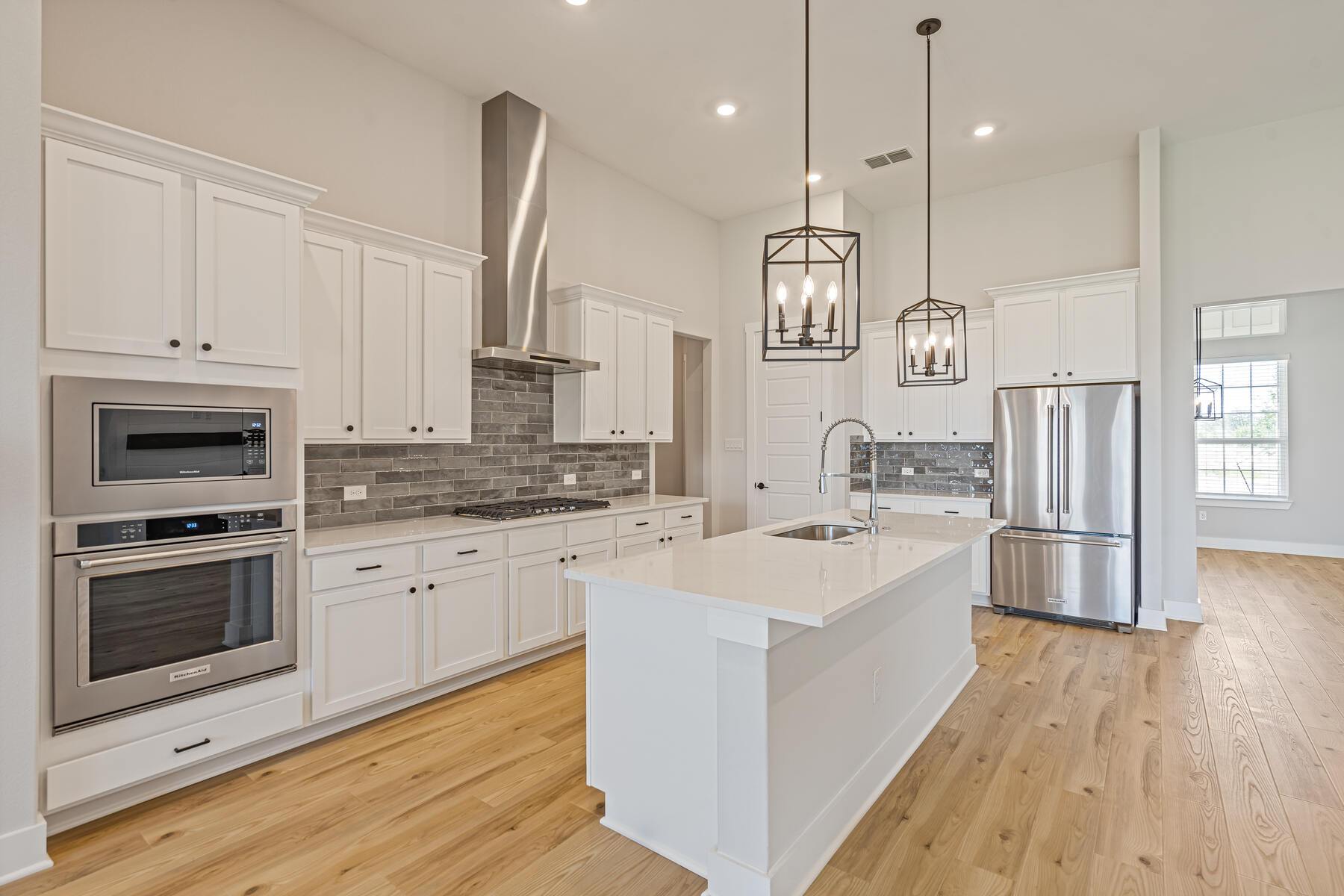 The kitchen has stainless steel appliances.