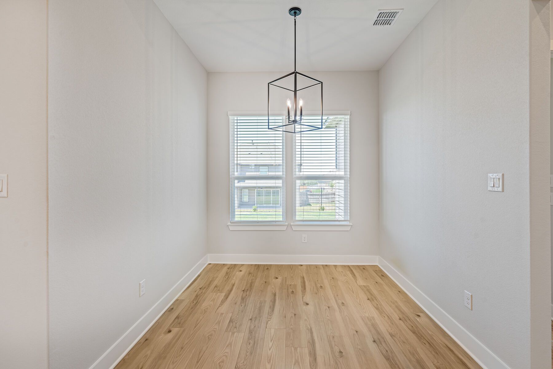The breakfast area sits right off of the kitchen and has a large window.