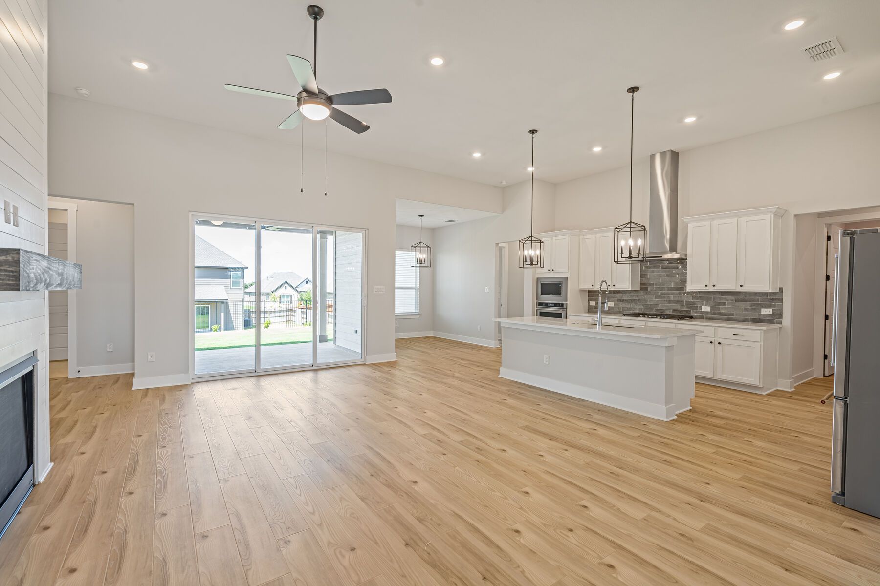 The Oxford has an open layout that connects the kitchen, dining area, and living room.