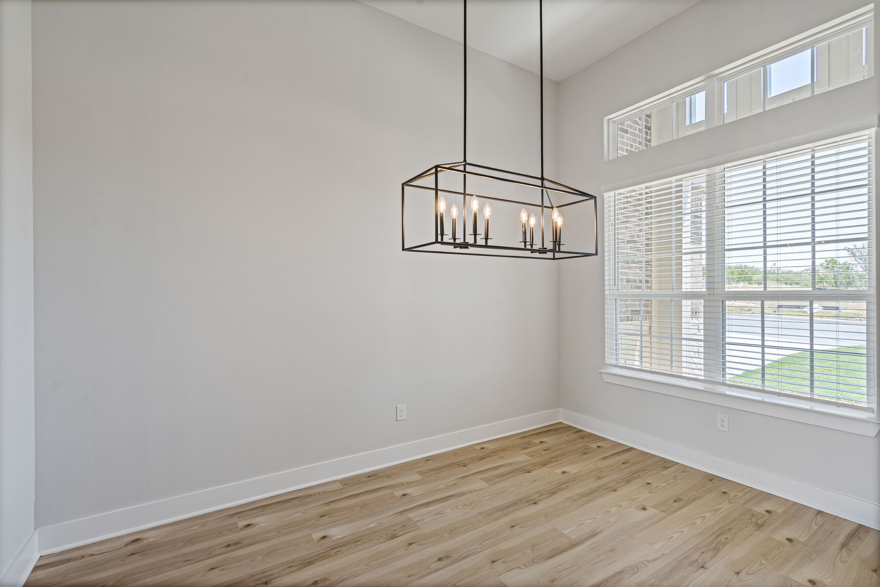 The dining room has large windows that let in great, natural light.