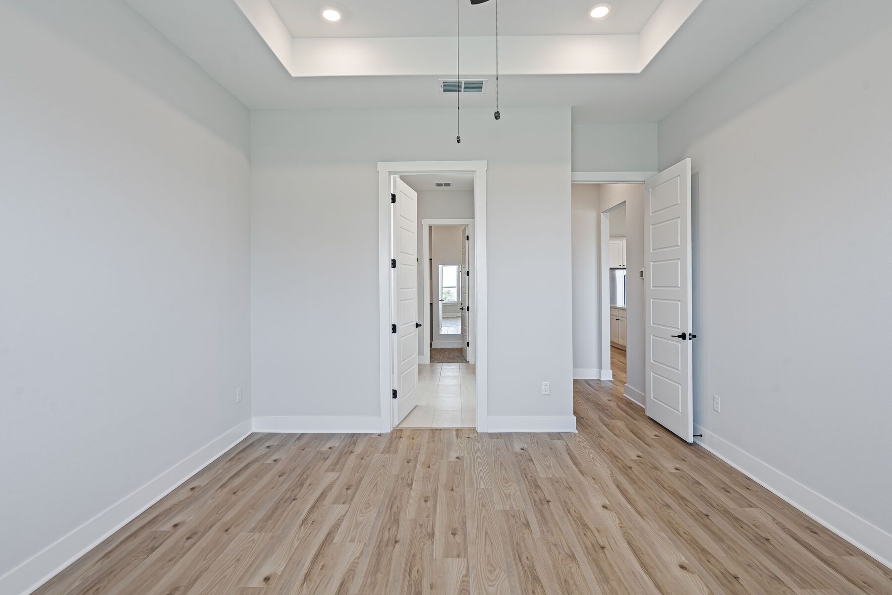 The master suite has a large bedroom, ensuite bathroom and a walk-in closet.