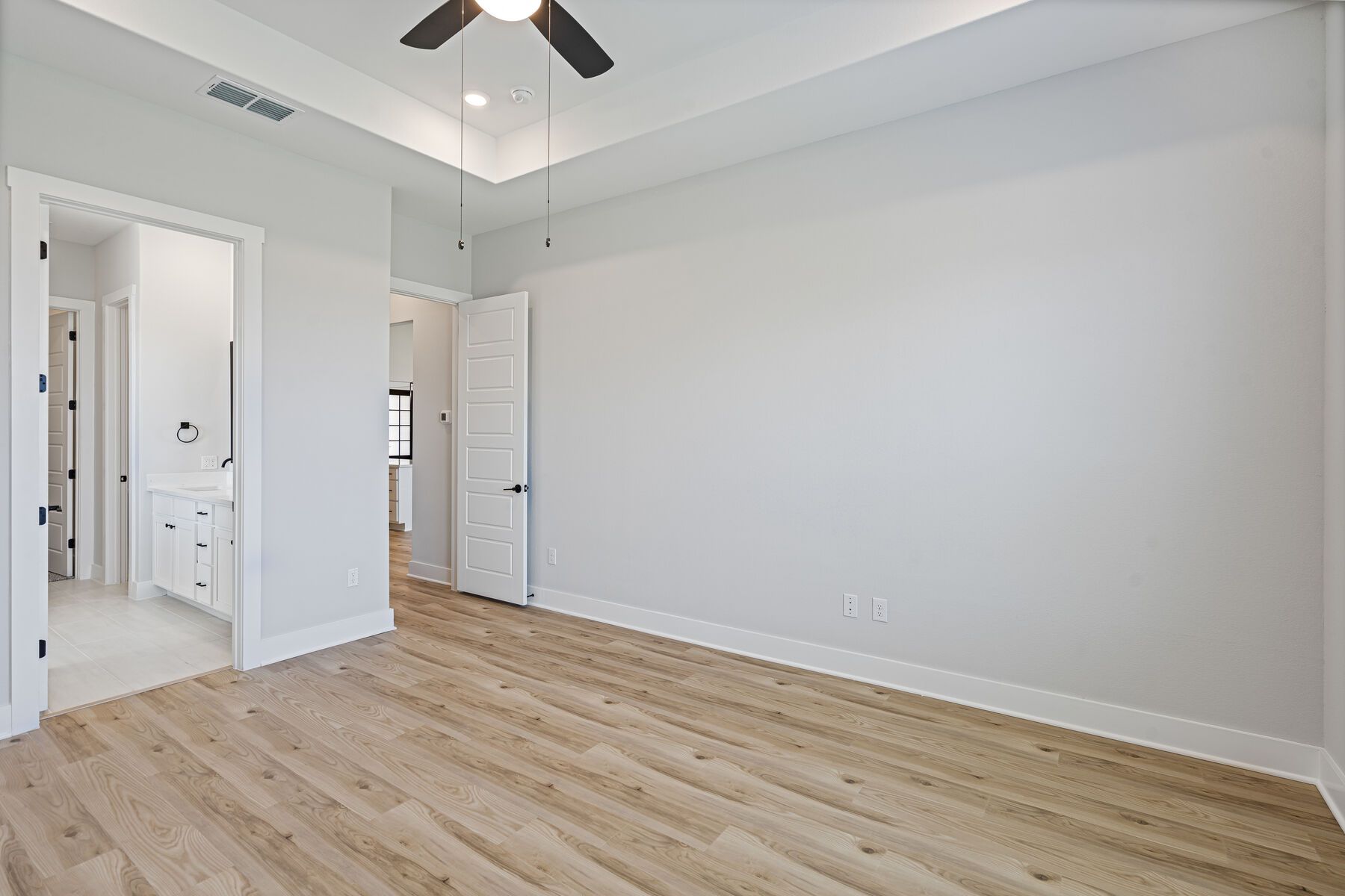 The master bedroom is spacious and an fit king-sized furniture.