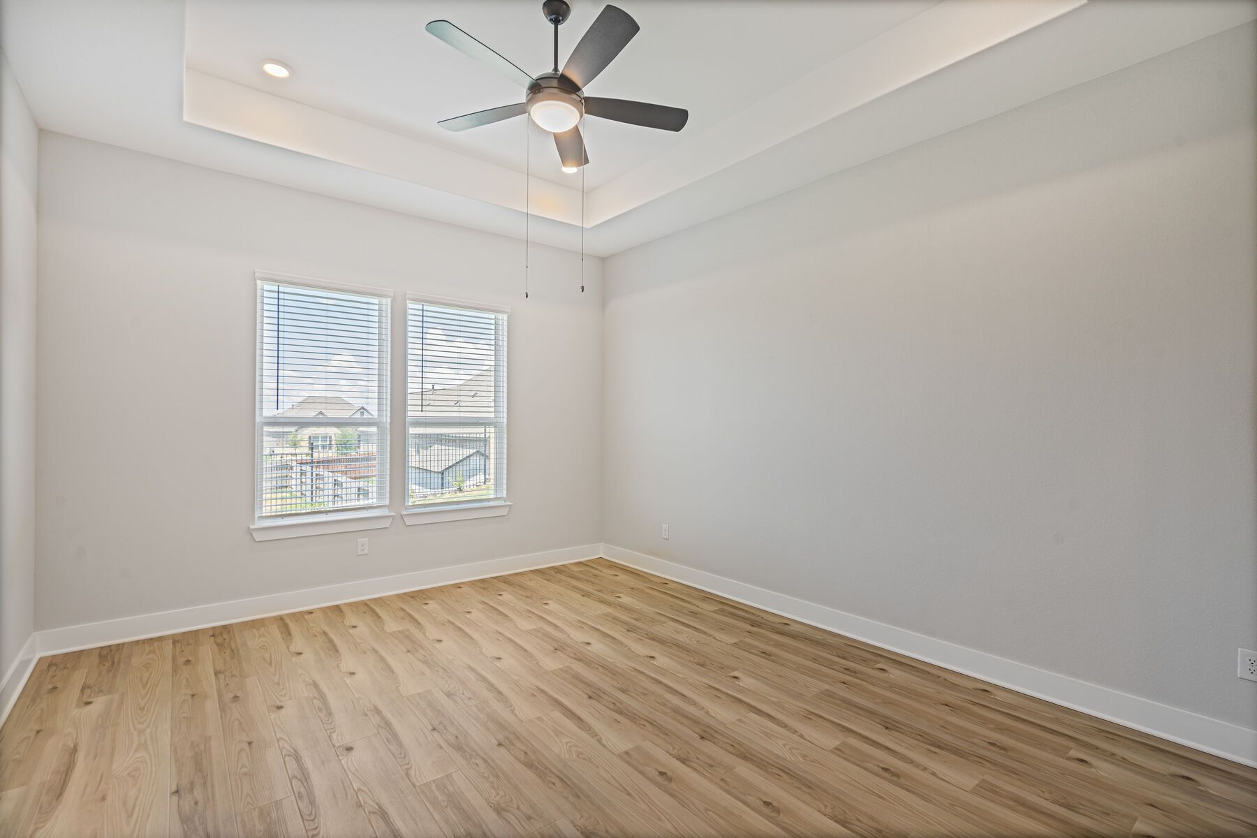 The master bedroom has two large windows that let in great, natural light.