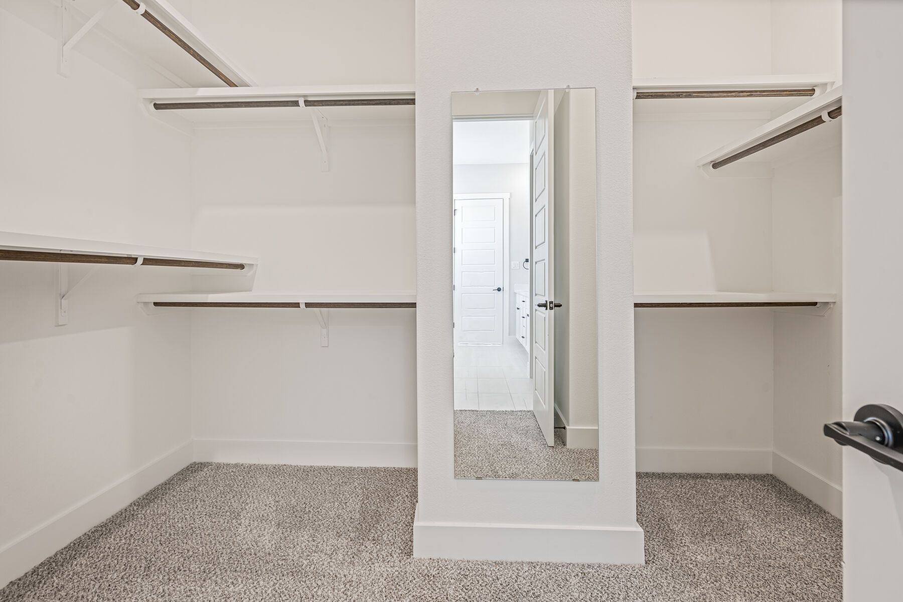 The master closet has plenty of haning and shelf space.