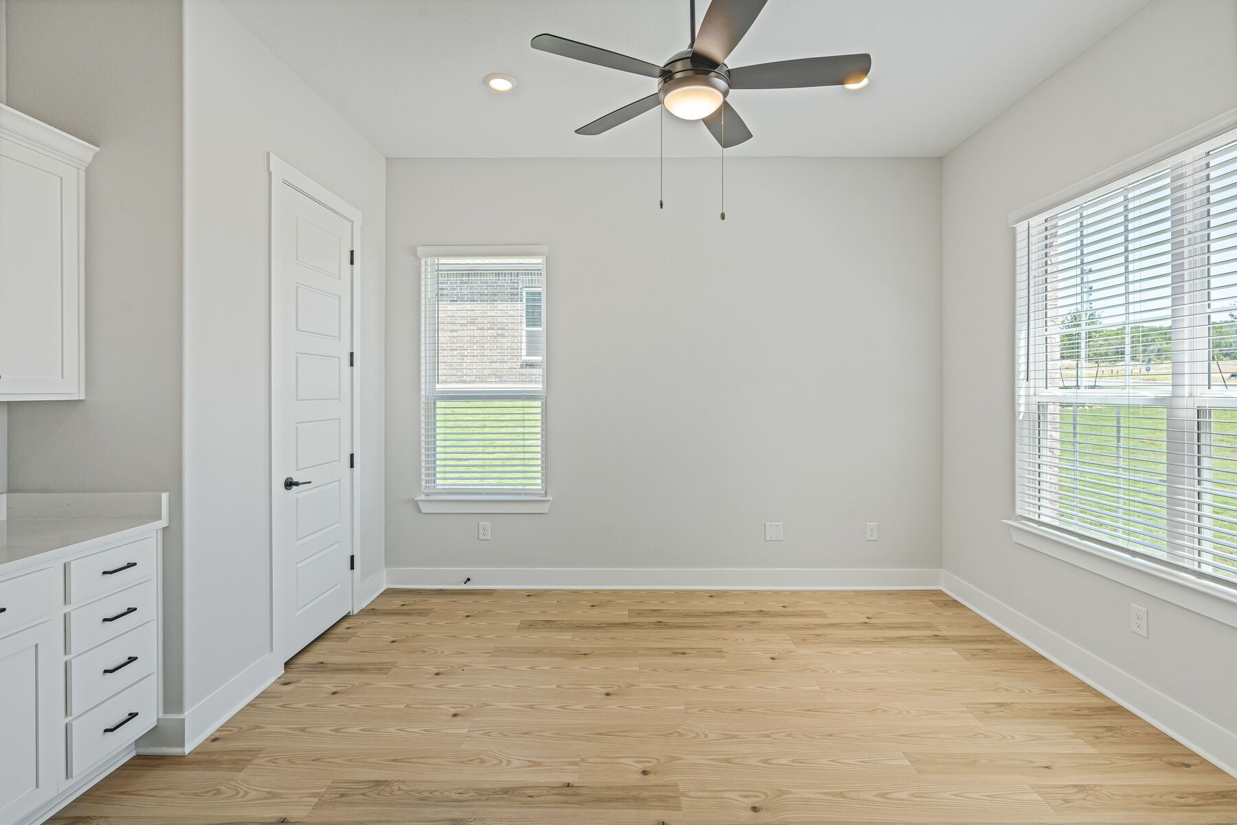 The flex room has large windows and lots of storage.