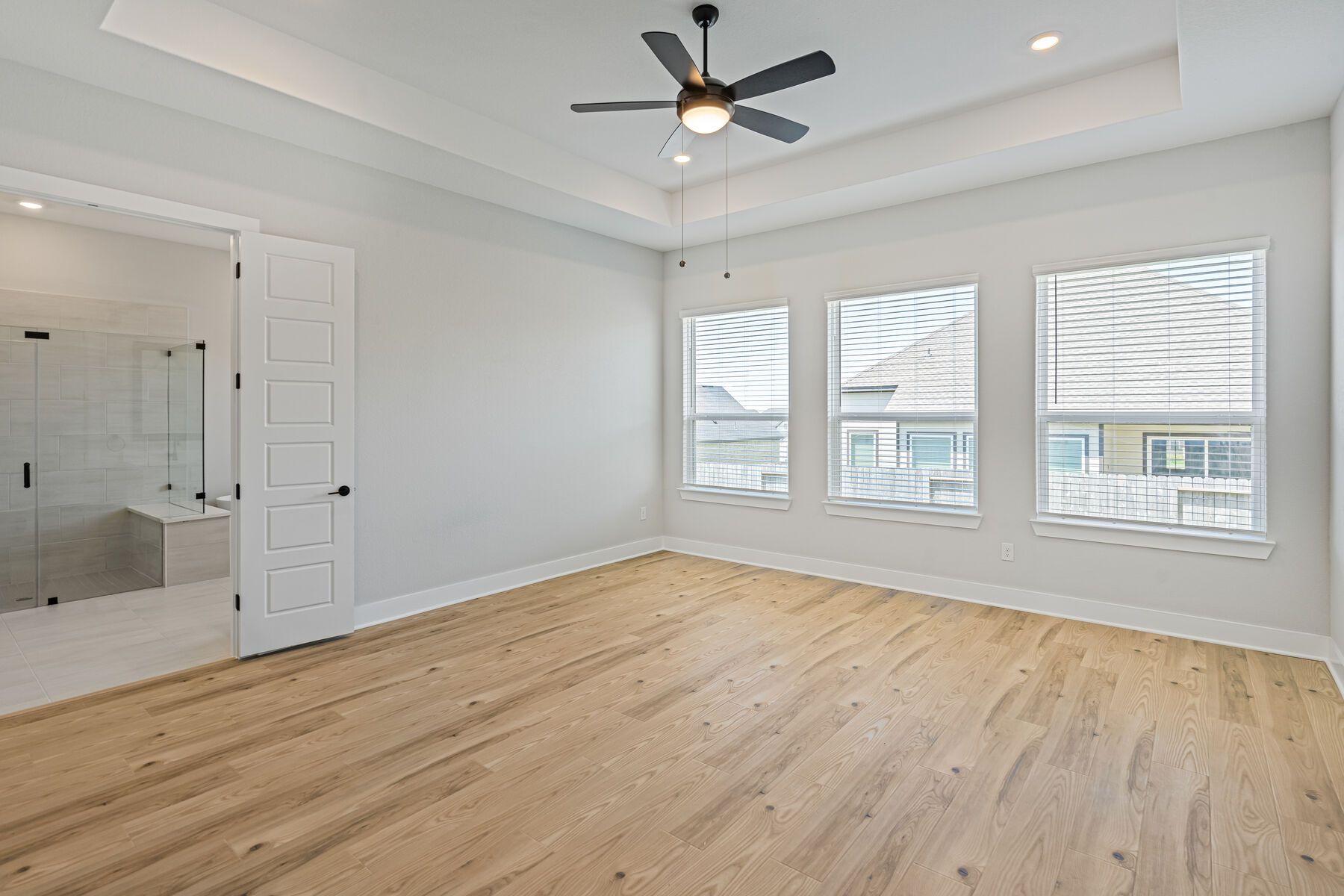 The master suite has a large bedroom, ensuite bathroom and walk-in closet.