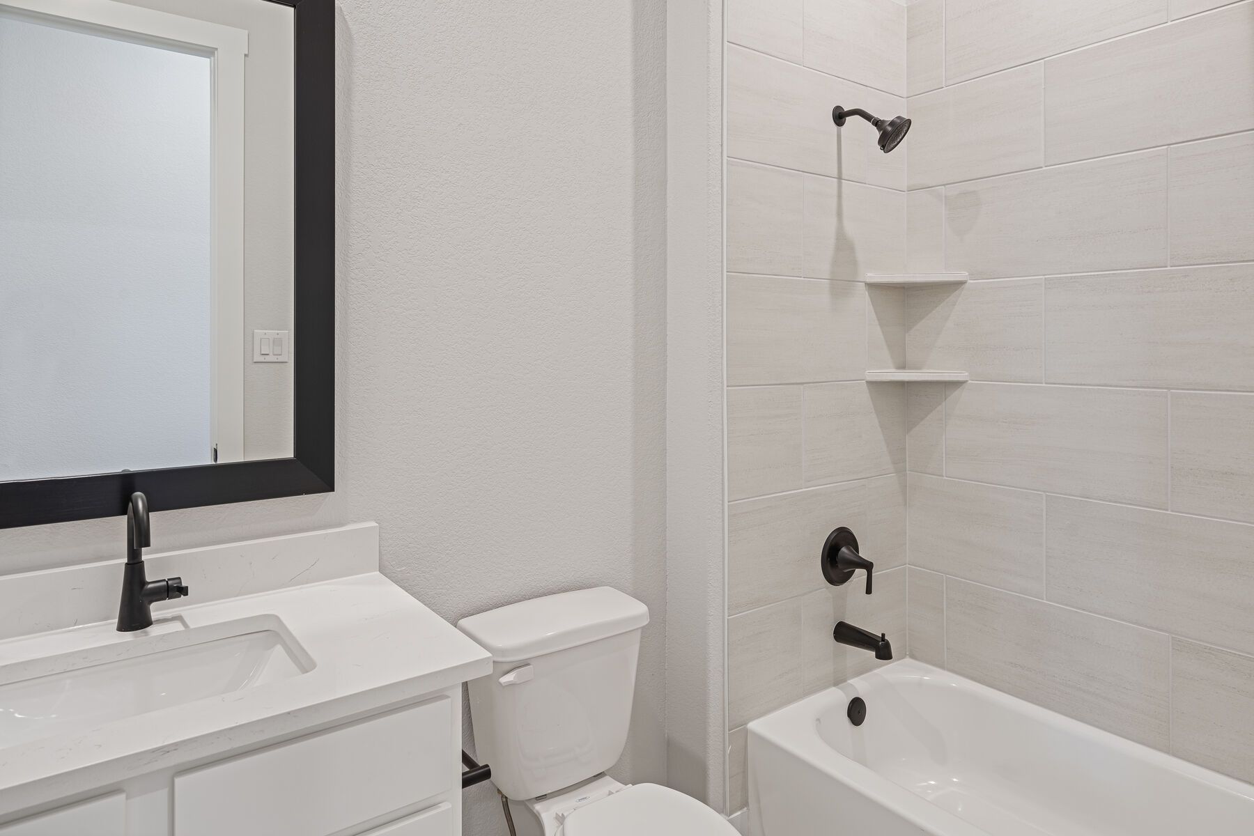 Both of the secondary bathroom has a vanity and shower-tub combo.