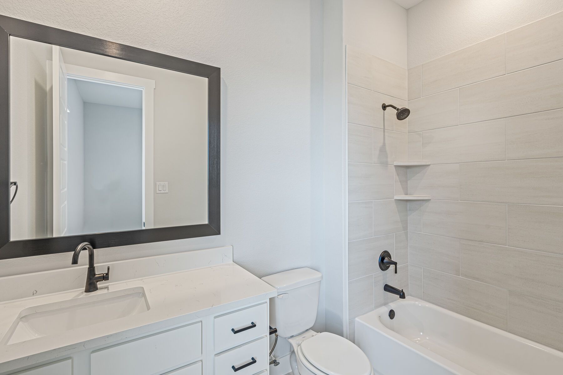 Both of the secondary bathroom has a vanity and shower-tub combo.