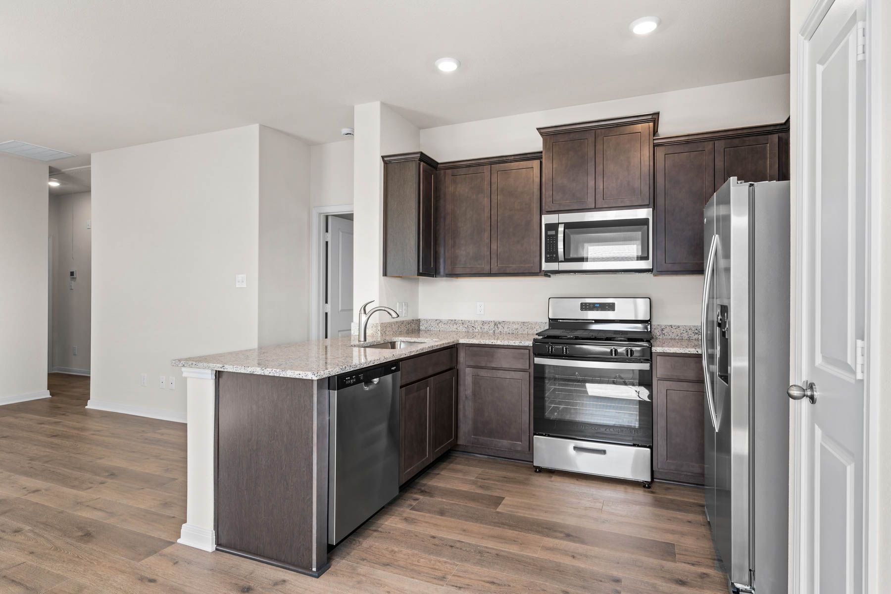 The kitchen has sprawling granite countertops.
