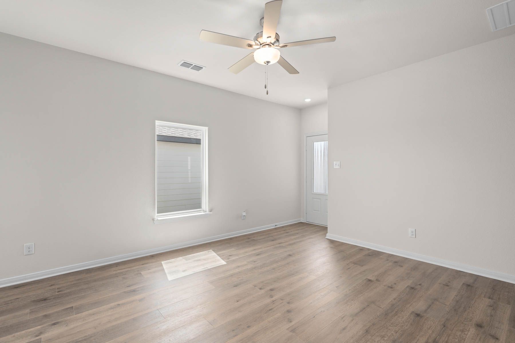 The family room is spacious and has plenty of room for furniture.