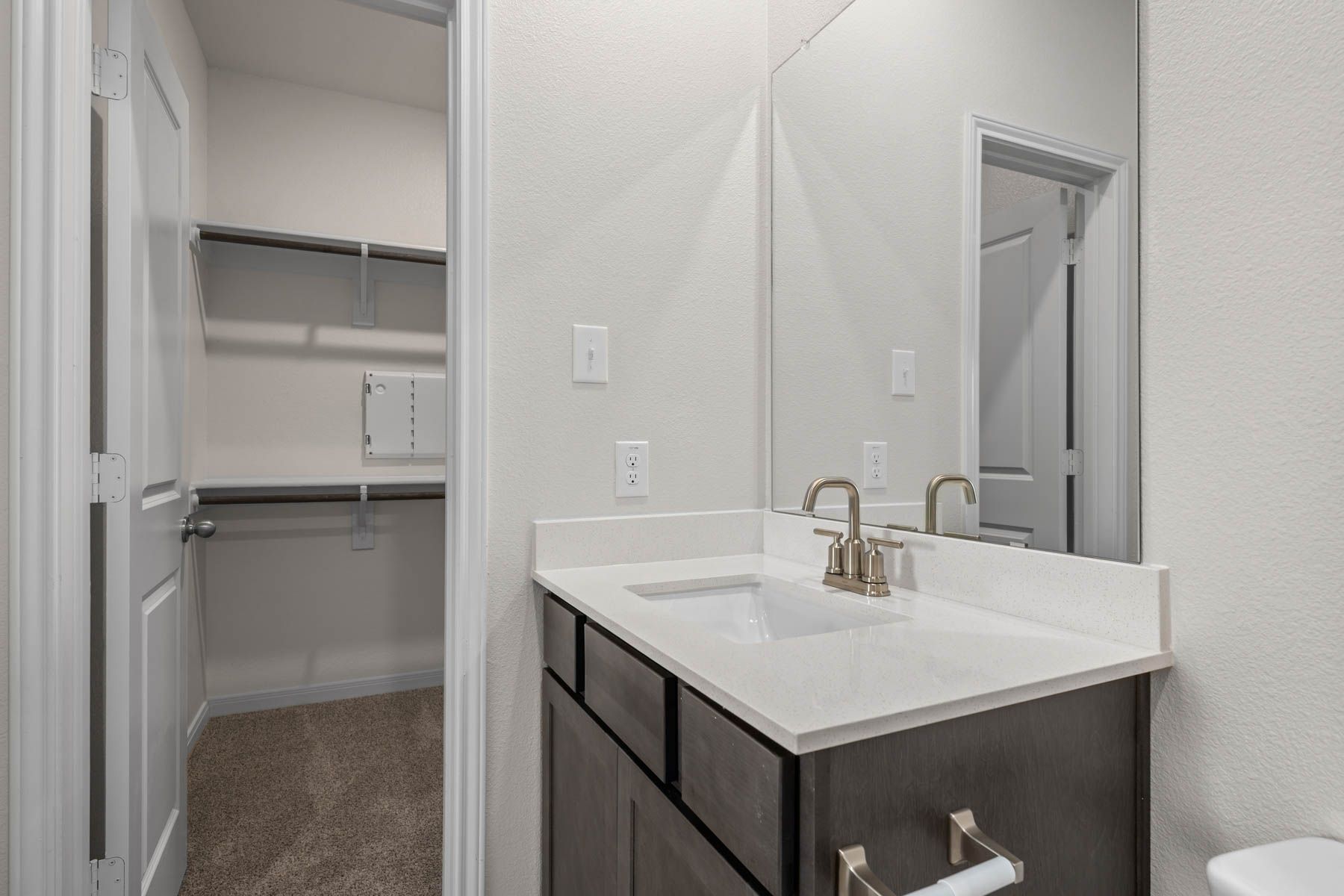 The master bathroom has a sprawling vanity.