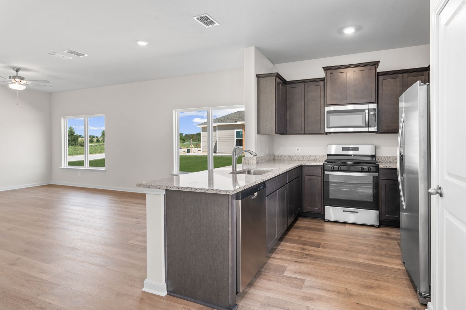 The kitchen has stainless steel appliances.