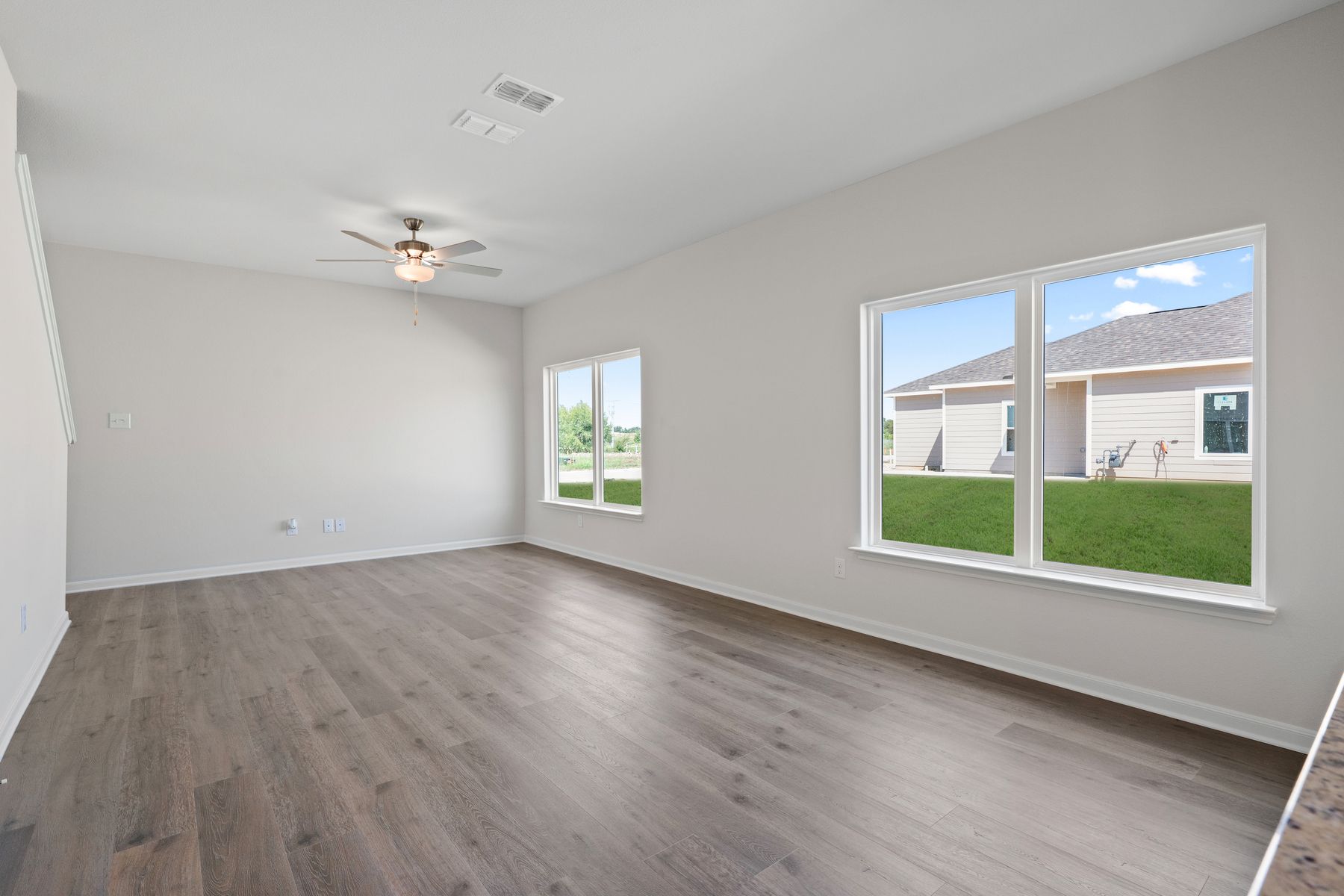 The family room is spacious and has plenty of space for large furniture. 