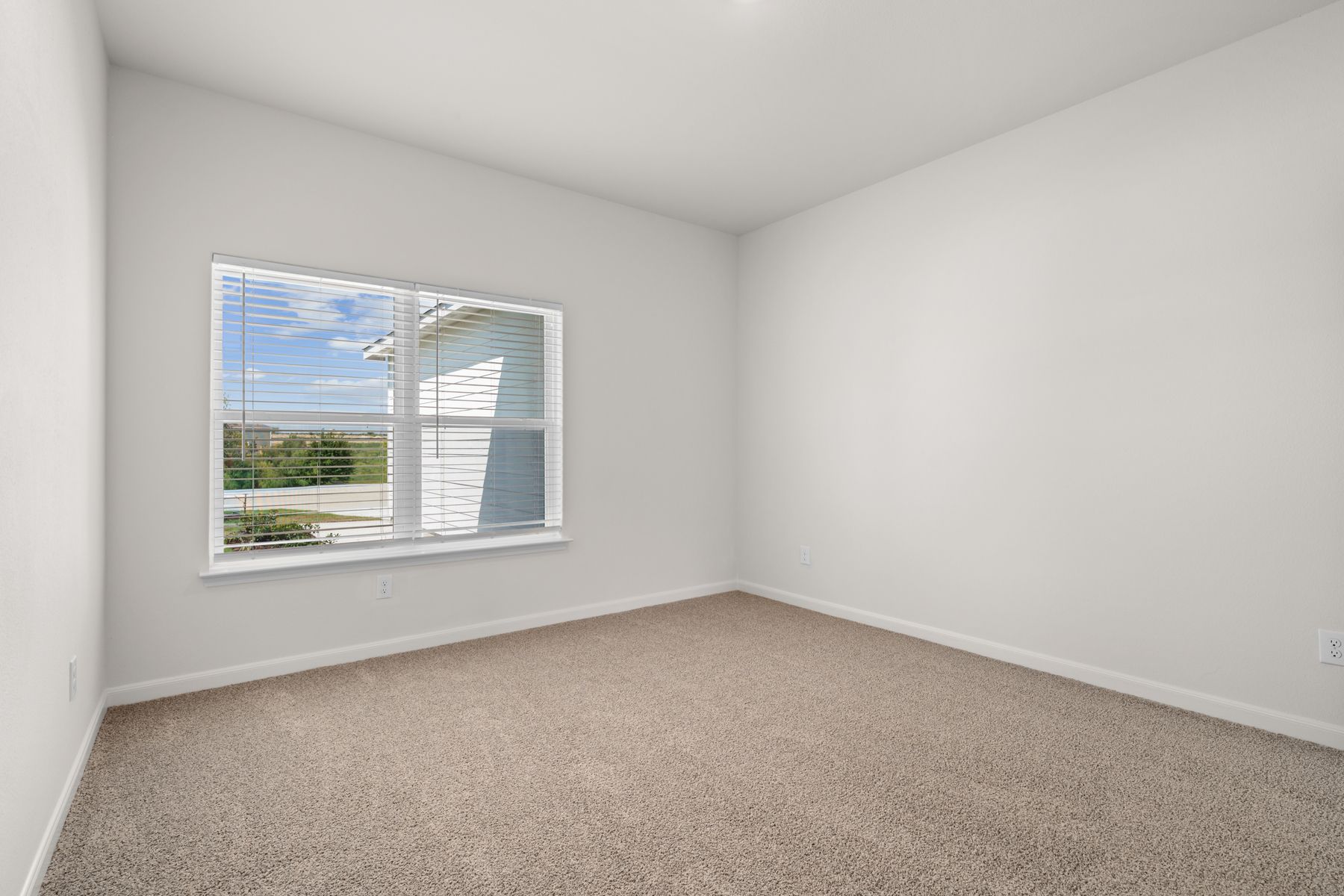 The master bedroom is large and has a great windows.