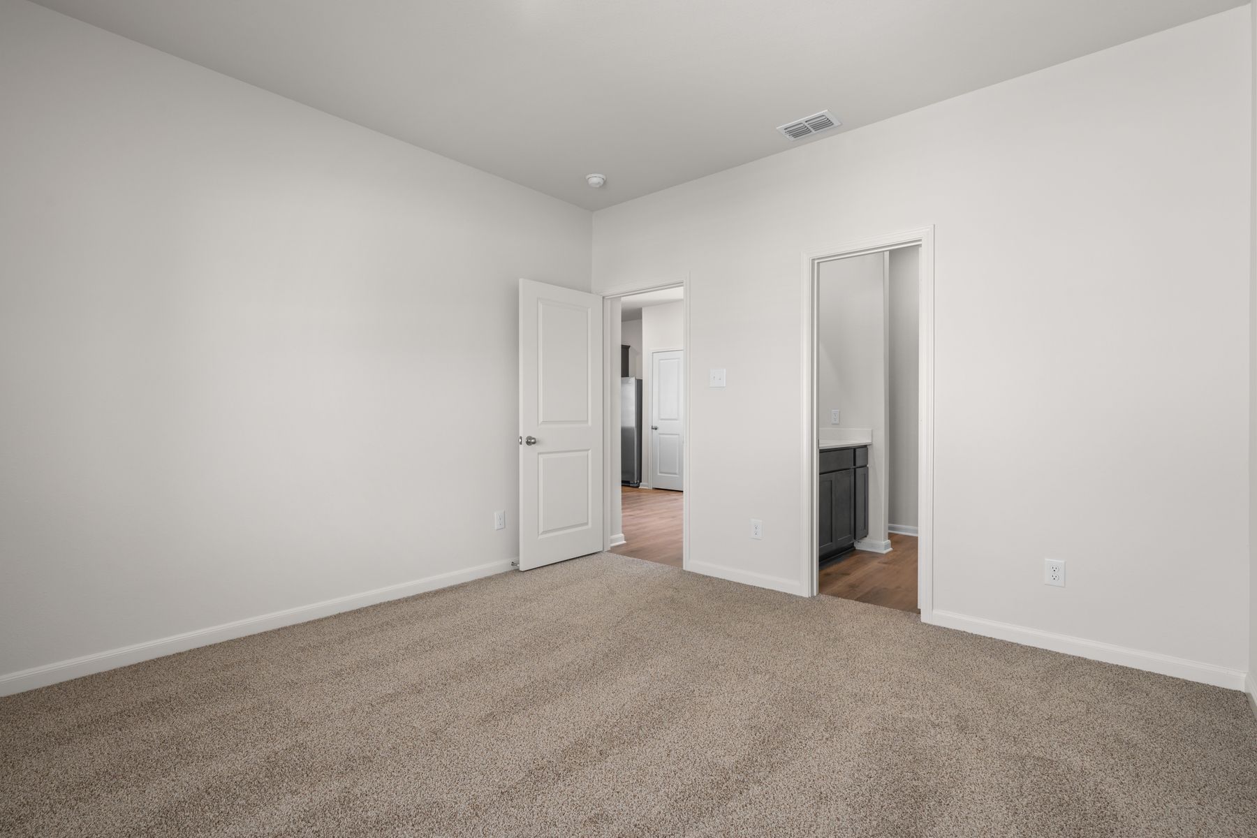 The master suite has a large bedroom, ensuite bathroom and a walk-in closet.