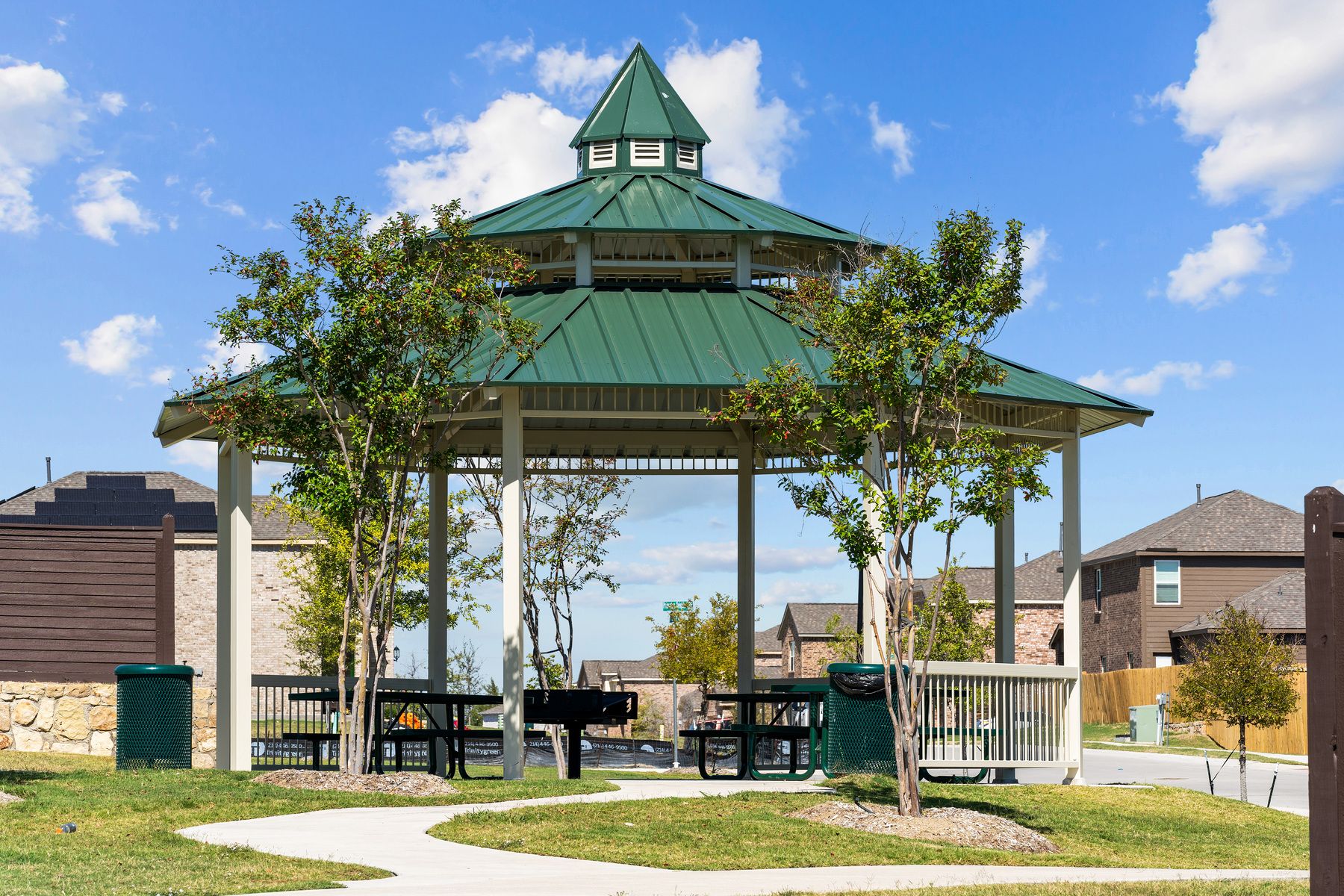 The gazebo has picnic tables.
