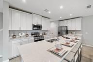 Townhomes at Sky Lakes Estates por Landsea Homes en Orlando Florida