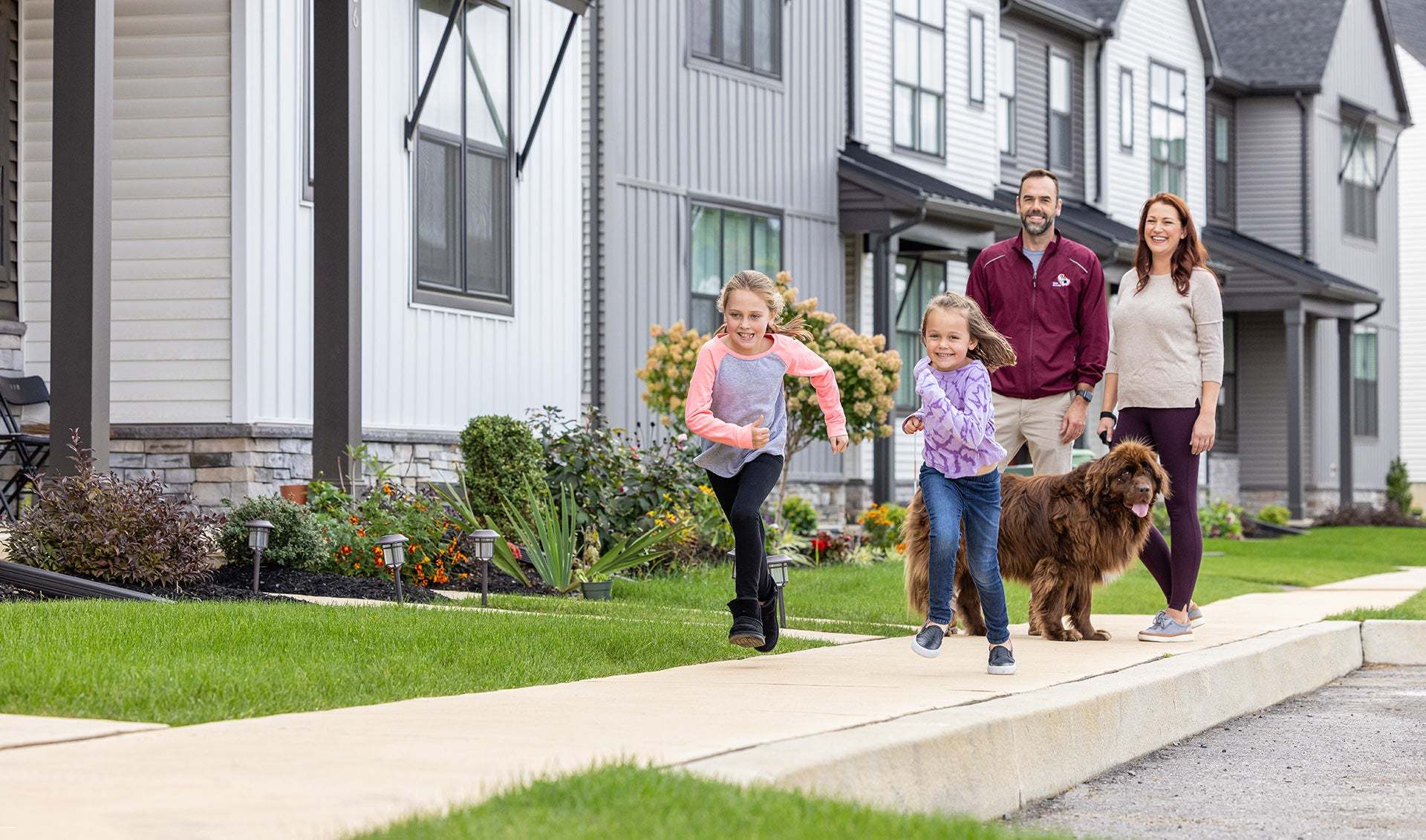 Family and Pet Walking in Landmark Homes Neighborhood