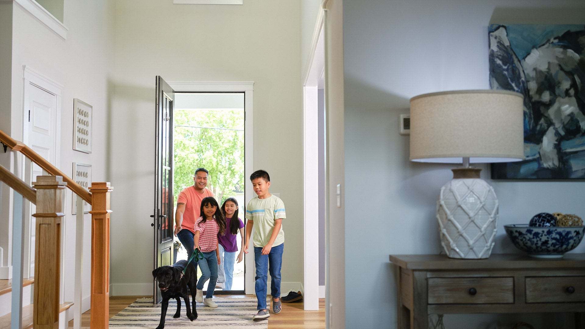 Family Entering New Home with Dog in Central PA