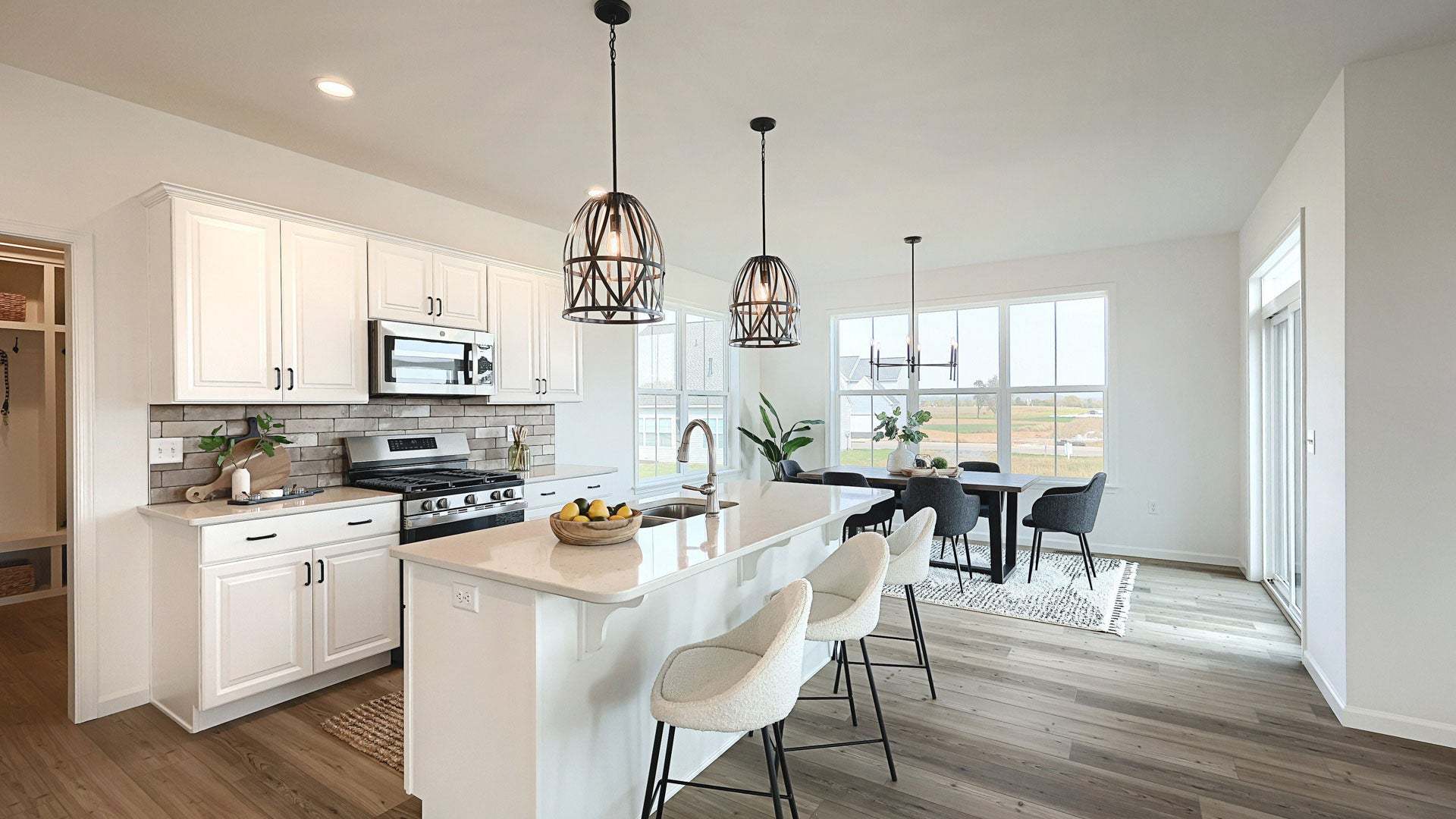 Open Kitchen with Bumped Out Dining Area in New Home Design by Landmark Homes in PA