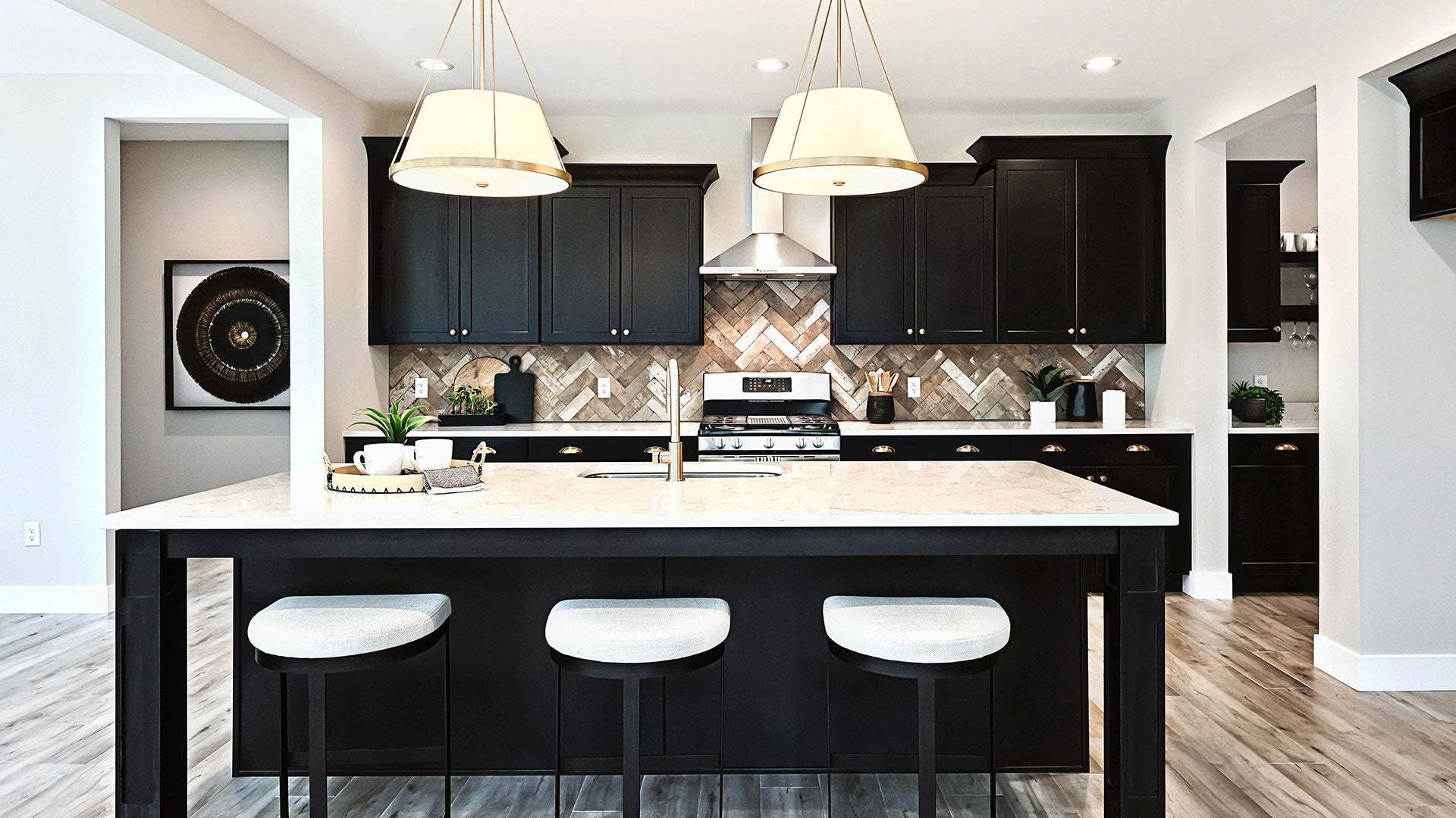 Kitchen with Dark Cabinetry and Extended Island in Callahan Custom Home Plan in PA