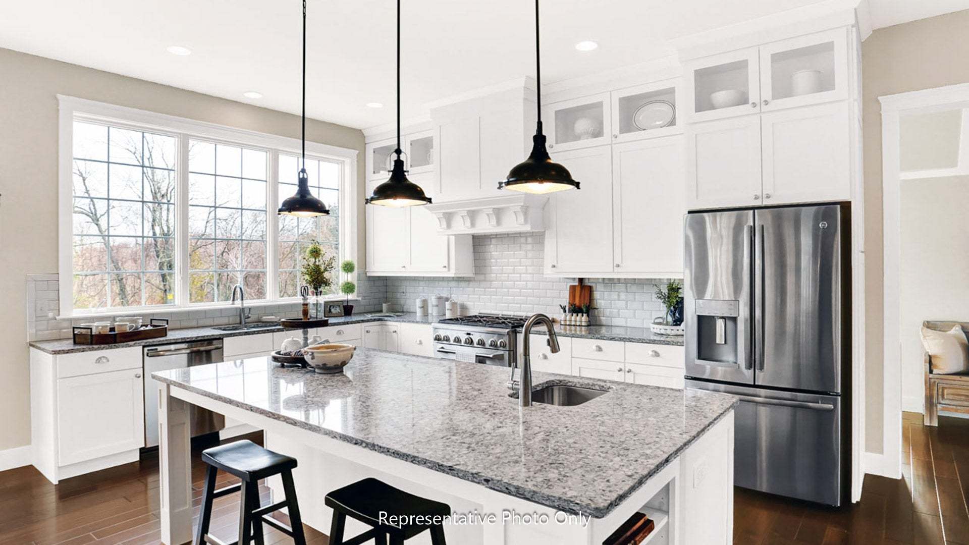 Center Island and Triple Windows in the Kitchen