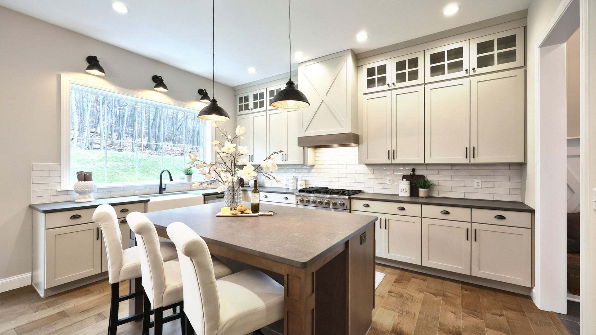 Open Kitchen with Large Window and Tall Kitchen Cabinets and
