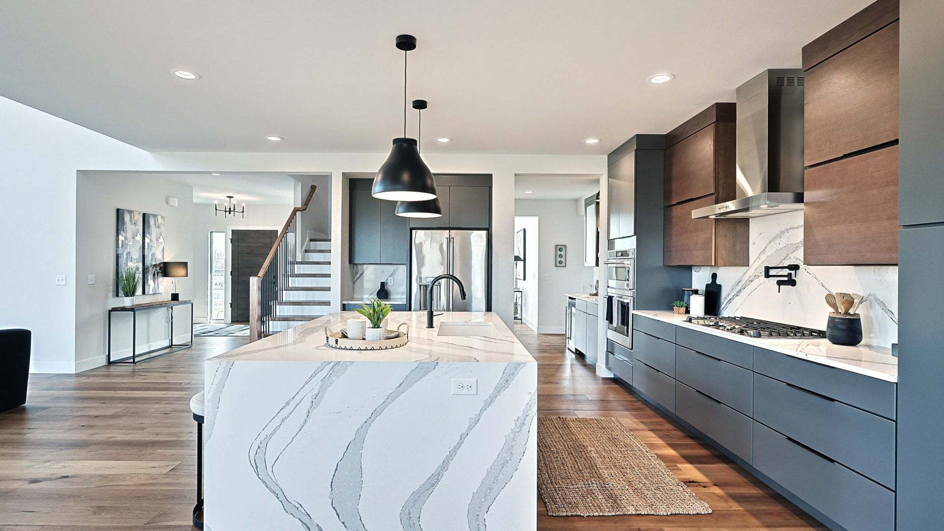 Custom Kitchen Design with Wood Tones and Marble