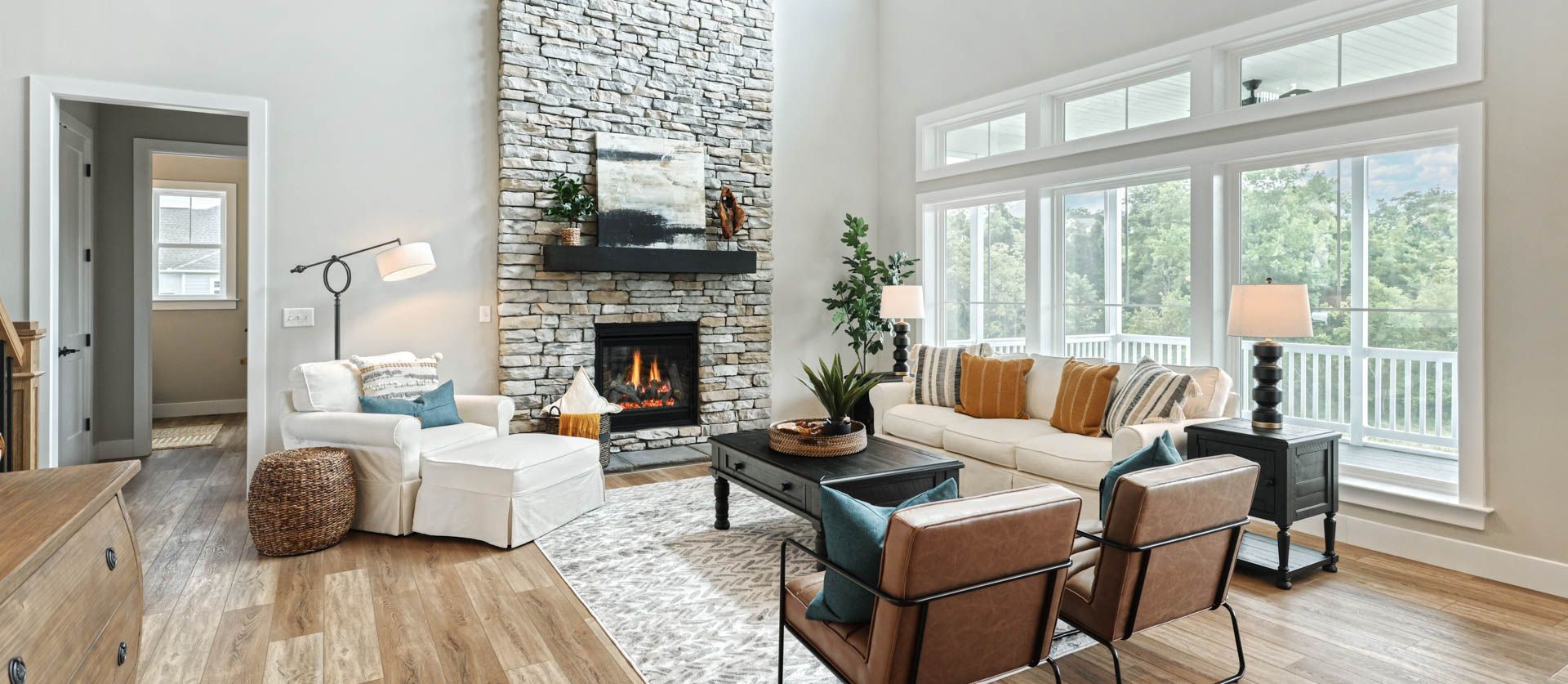 2-Story Great Room with Floor to Ceiling Stone Surround in Custom Home Design