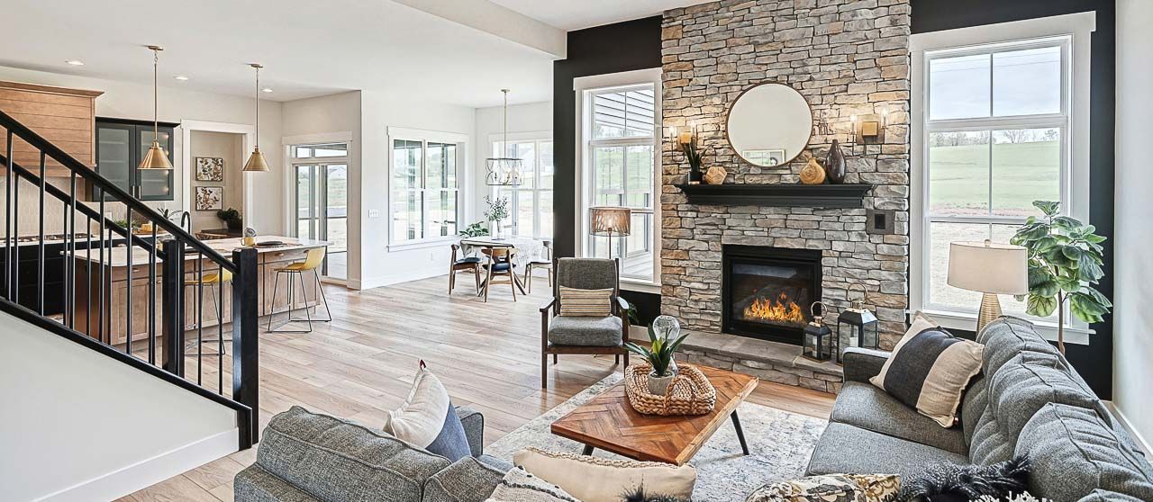 Cozy Fireplace with Floor to ceiling Stone Surround in New Construction Home in PA by Landmark Homes