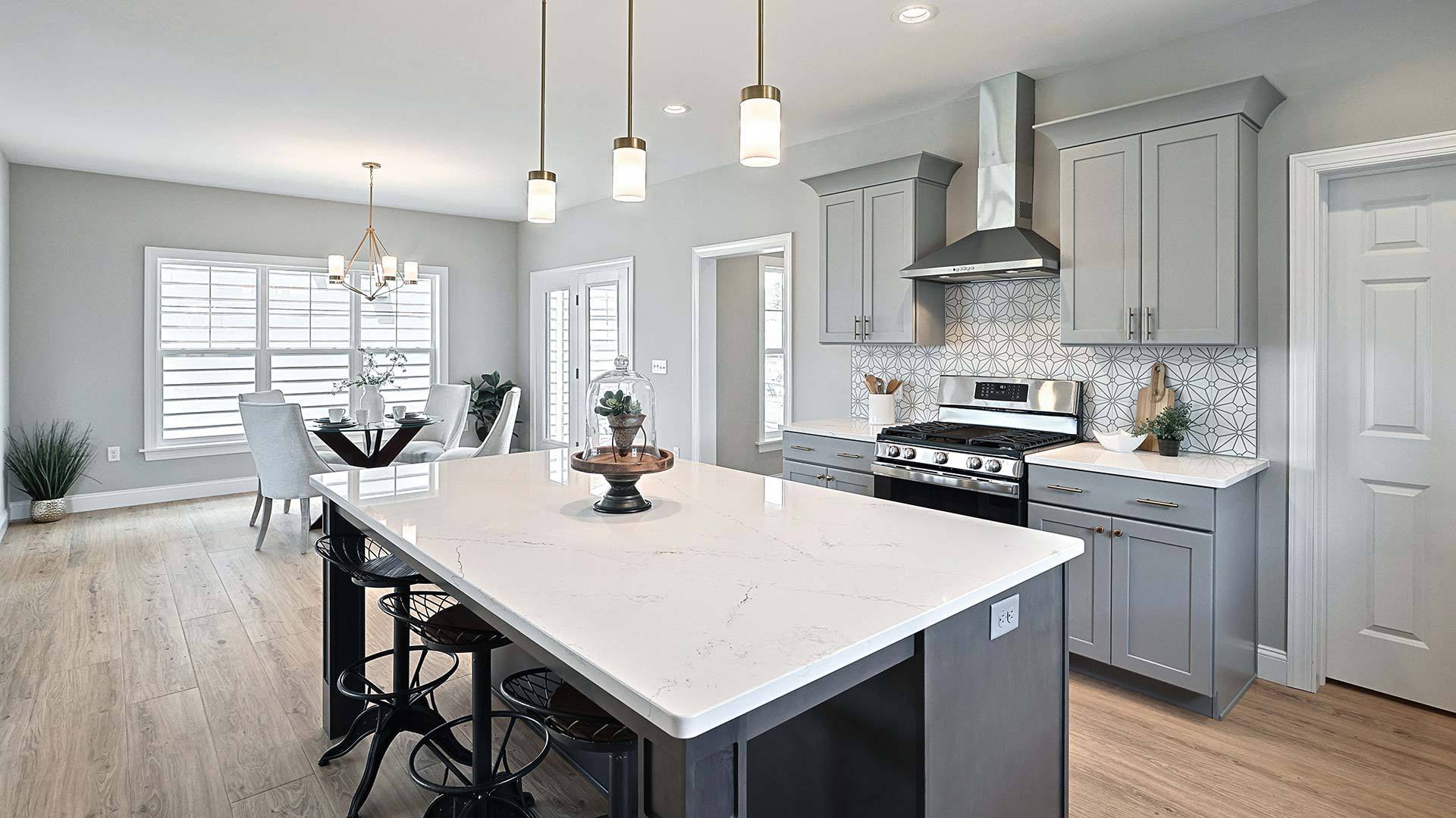 Open Kitchen with Quartz Countertops and Light Filled Dining Area