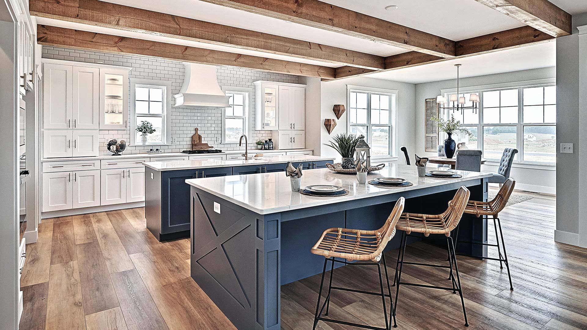 Sullivan Kitchen with Double Islands and Beamed Ceiling in Summer Layne New Home Community in PA