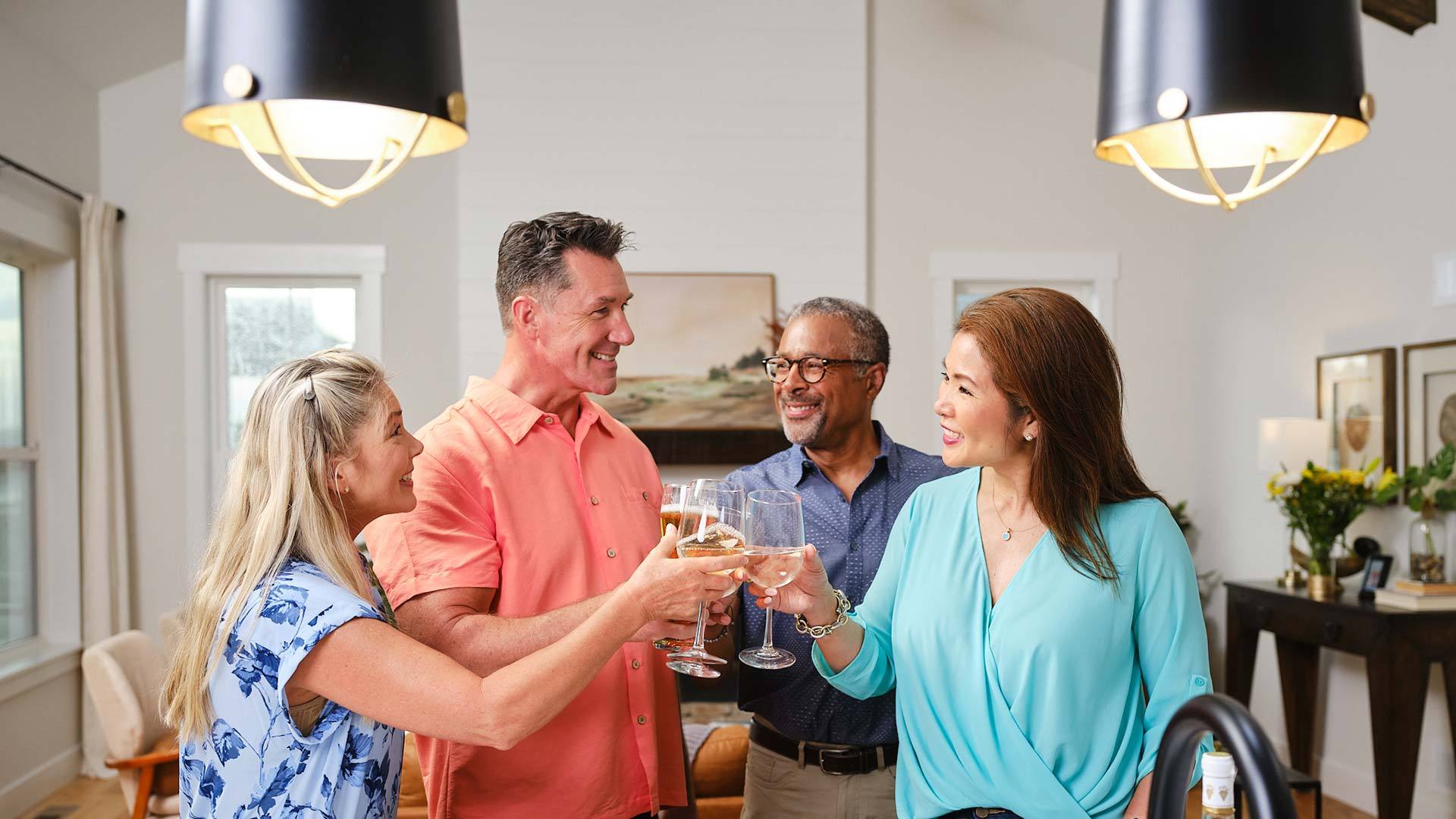 55 and older friends toasting drinks in a Landmark Homes 55+ community