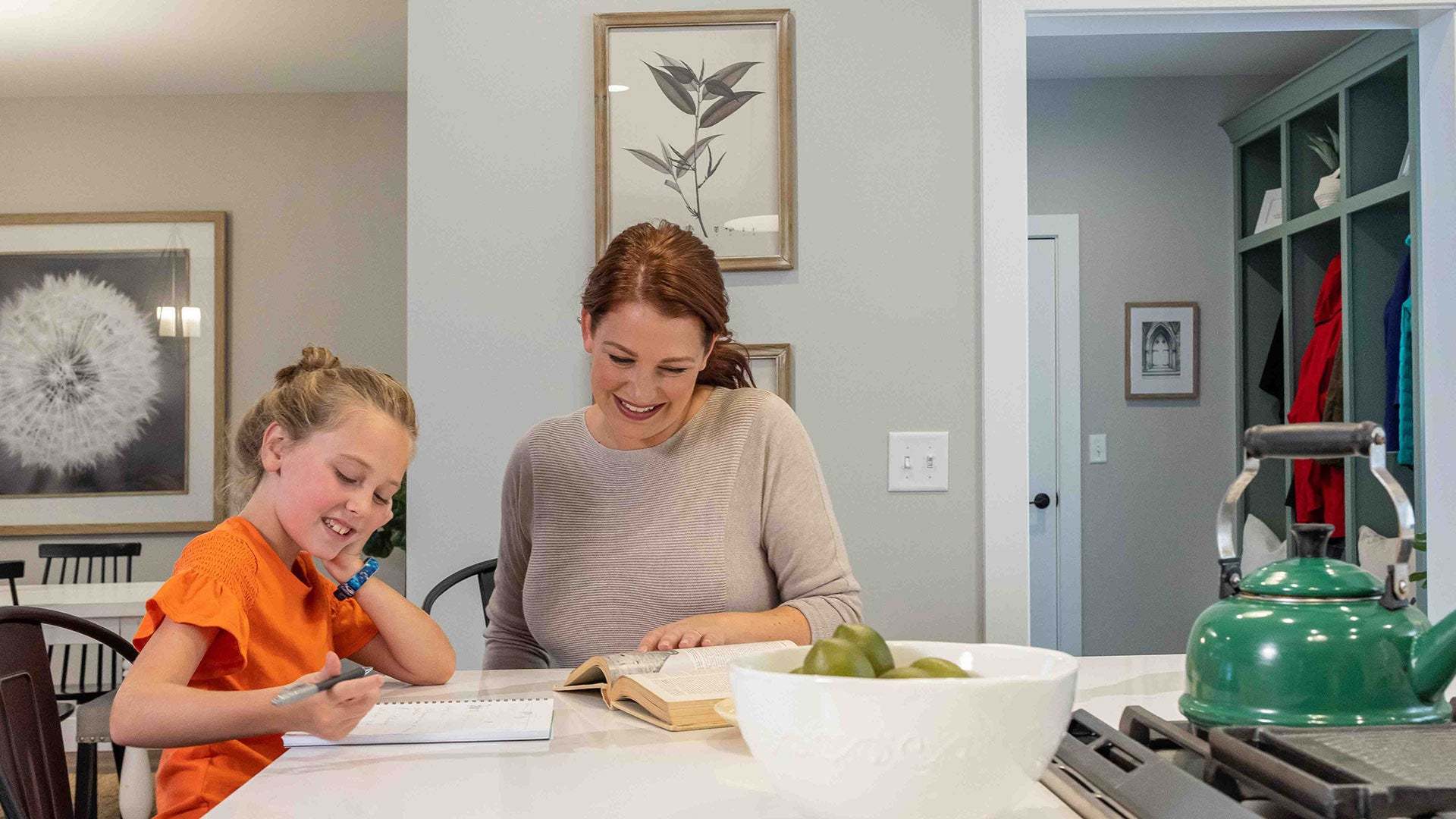 Mother and Daughter at Kitchen Island in New Home by Landmark Homes of PA